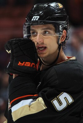ANAHEIM, CA - APRIL 06:  Luca Sbisa #5 of the Anaheim Ducks talks to a teammate against the San Jose Sharks at Honda Center on April 6, 2011 in Anaheim, California.  (Photo by Jeff Gross/Getty Images)