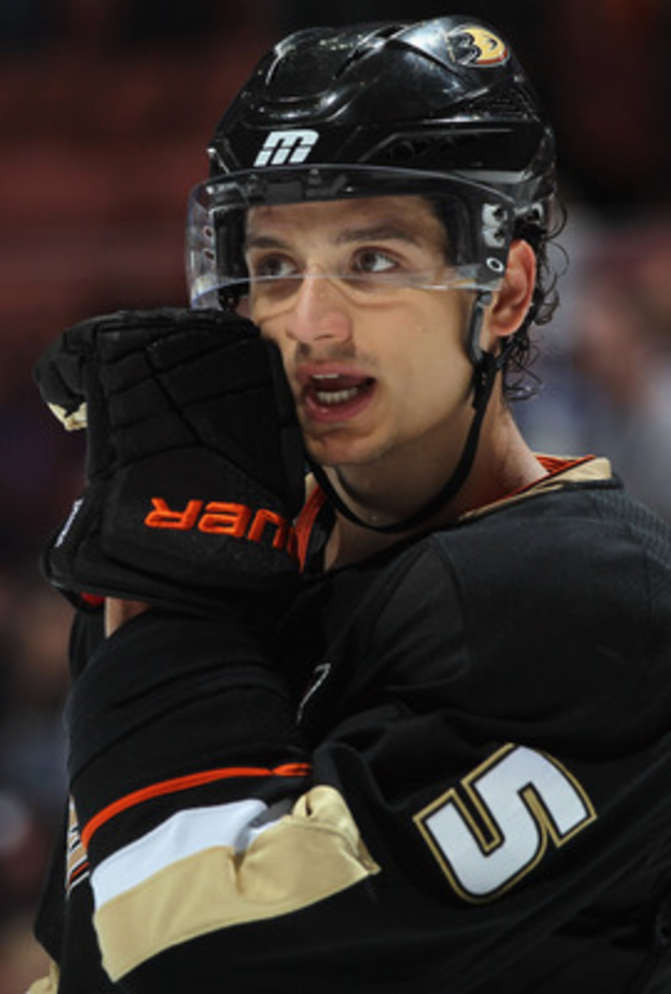 ANAHEIM, CA - APRIL 06:  Luca Sbisa #5 of the Anaheim Ducks talks to a teammate against the San Jose Sharks at Honda Center on April 6, 2011 in Anaheim, California.  (Photo by Jeff Gross/Getty Images)