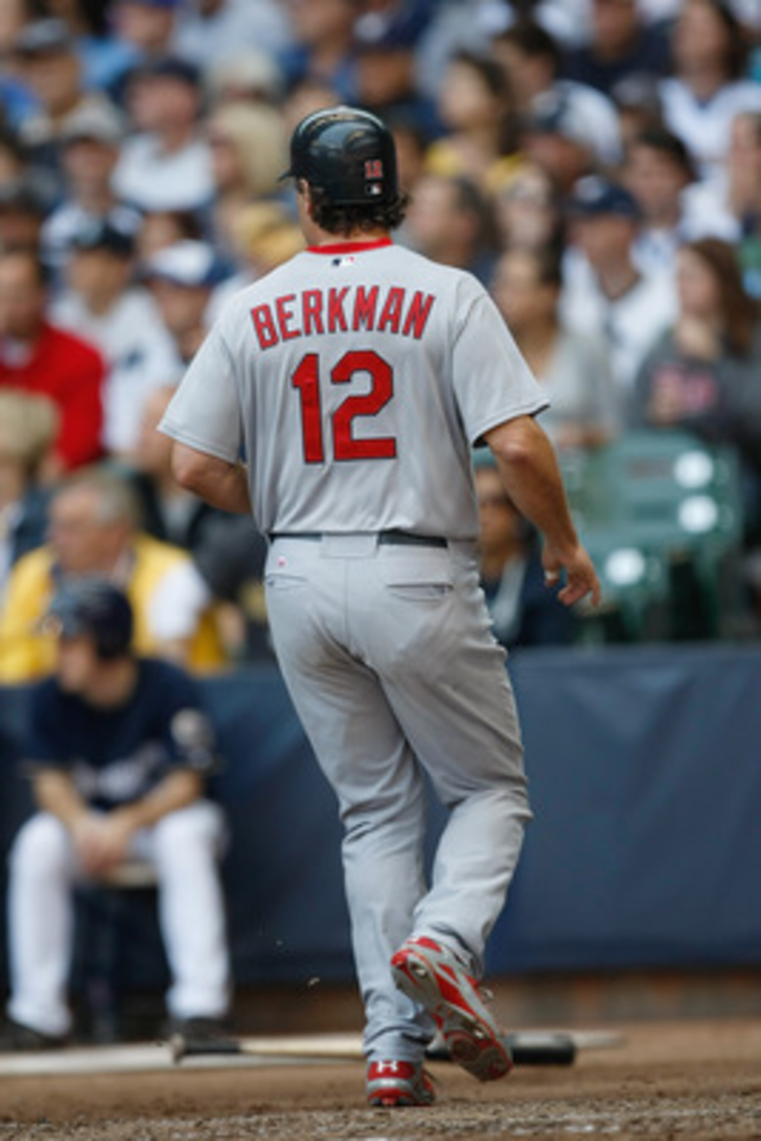 MILWAUKEE, WI - JUNE 12: Lance Berkman #12 of the St. Louis Cardinals steps on home plate as he scores a run against the Milwaukee Brewers at Miller Park on June 12, 2011 in Milwaukee, Wisconsin. (Photo by Scott Boehm/Getty Images)