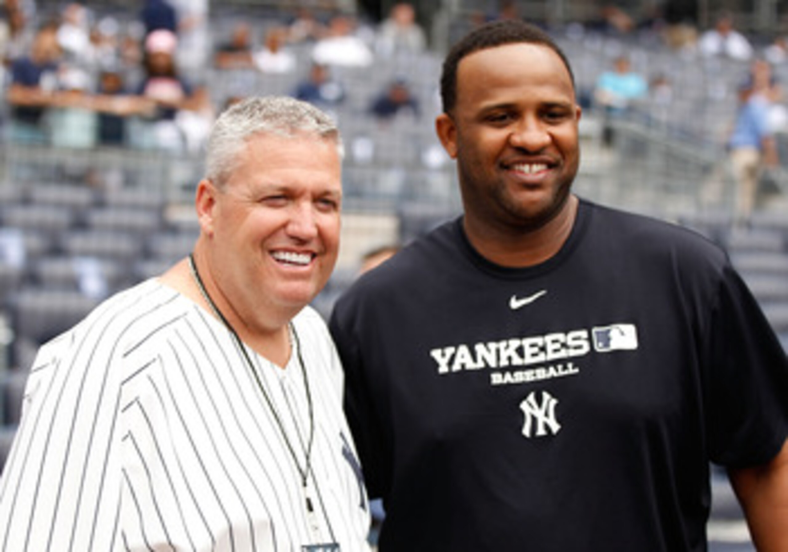 NEW YORK - JUNE 12:  New York Jets head coach Rex Ryan poses for a photo with CC Sabathia #52 of the New York Yankees on June 12, 2011 at Yankee Stadium in the Bronx borough of New York City.  (Photo by Mike Stobe/Getty Images)