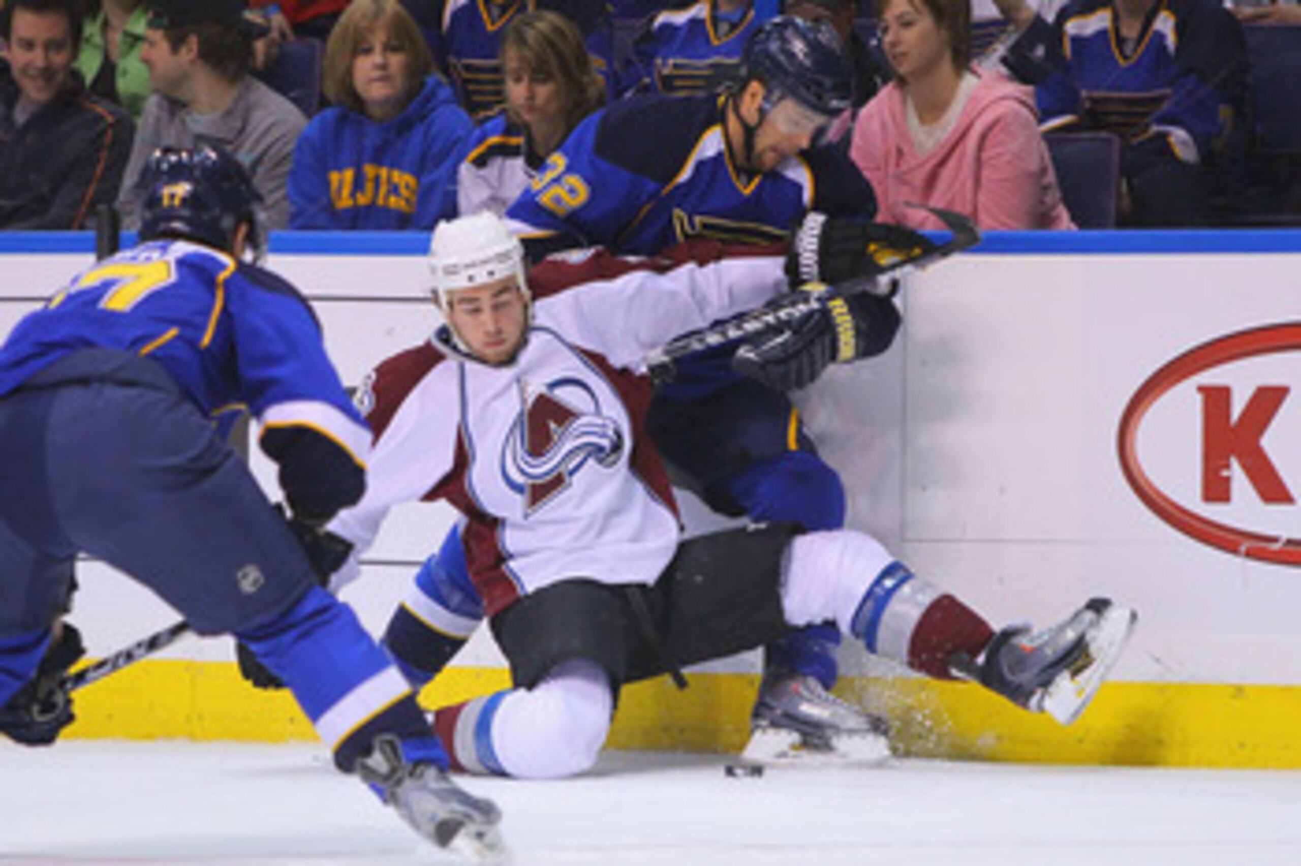 ST. LOUIS, MO - APRIL 5: Chris Porter #32 of the St. Louis Blues trips Ryan O'Reilly #37 of the Colorado Avalanche at the Scottrade Center on April 5, 2011 in St. Louis, Missouri.  (Photo by Dilip Vishwanat/Getty Images)