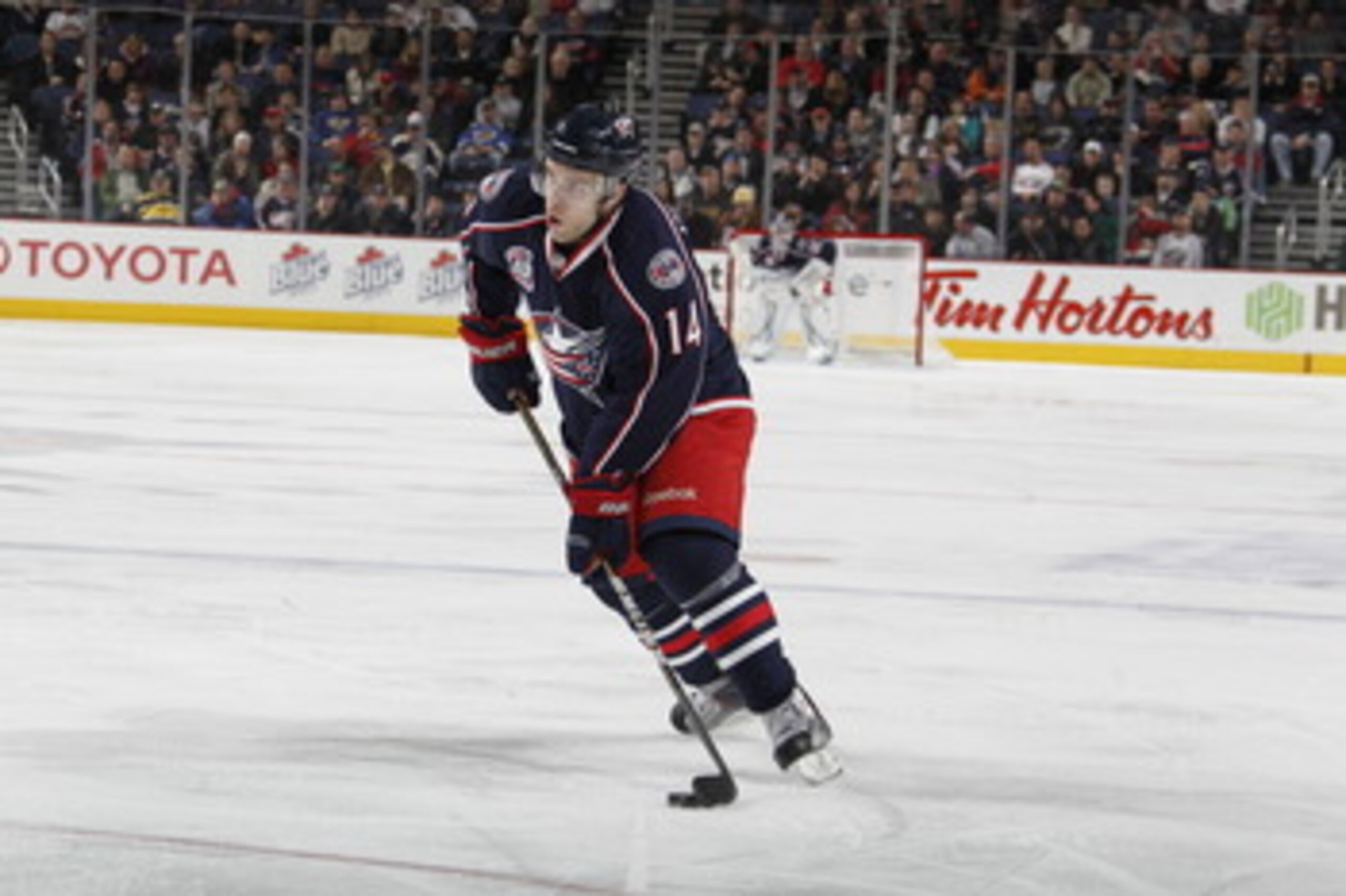 COLUMBUS, OH - MARCH 09:  Grant Clitsome #14 of the Columbus Blue Jackets skates with the puck while playing against the St. Louis Blues on March 9, 2011 at Nationwide Arena in Columbus, Ohio.  (Photo by Gregory Shamus/Getty Images)