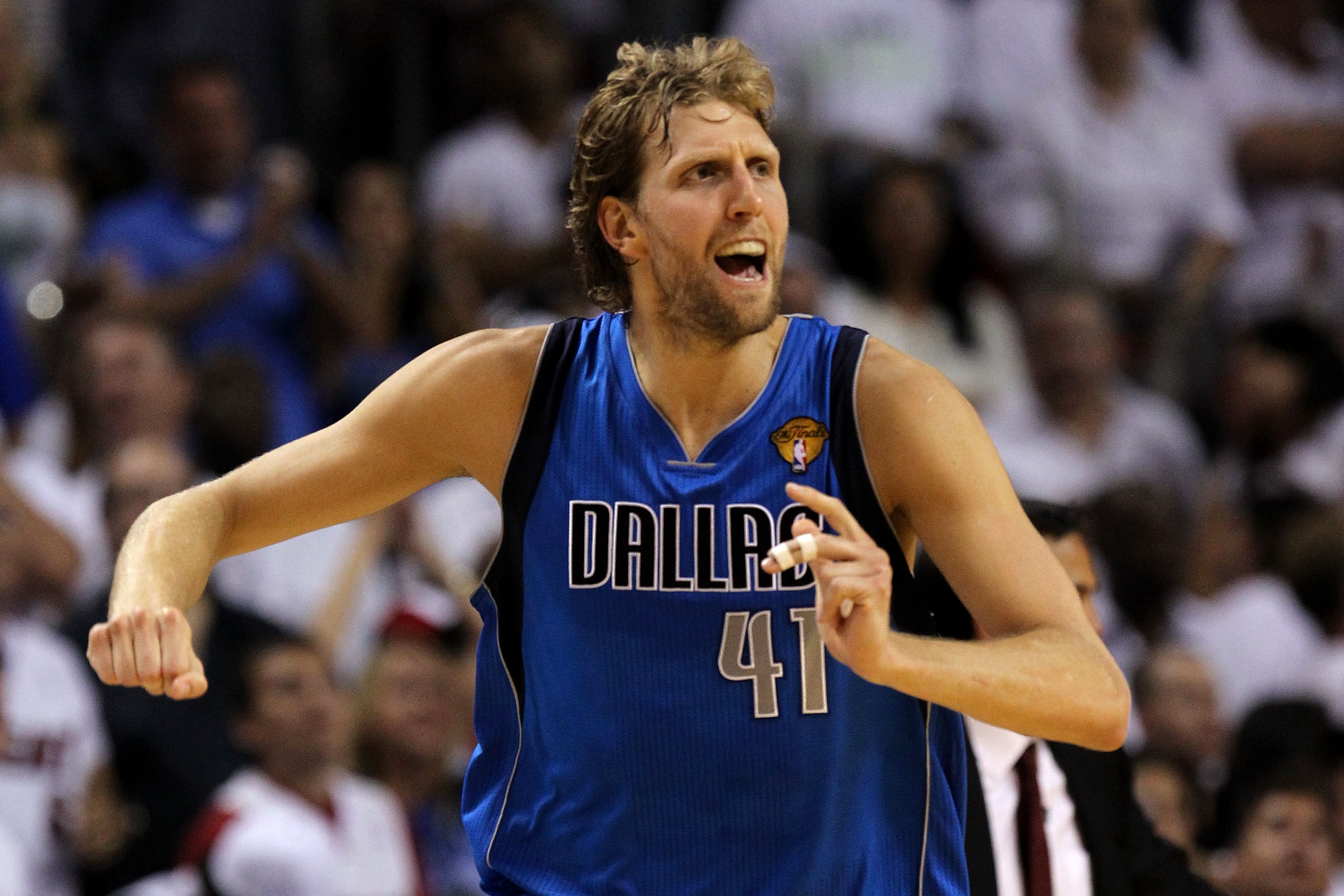 MIAMI, FL - JUNE 12:  Dirk Nowitzki #41 of the Dallas Mavericks reacts after making a three-pointer in the fourth quarter while taking on the Miami Heat in Game Six of the 2011 NBA Finals at American Airlines Arena on June 12, 2011 in Miami, Florida. NOTE