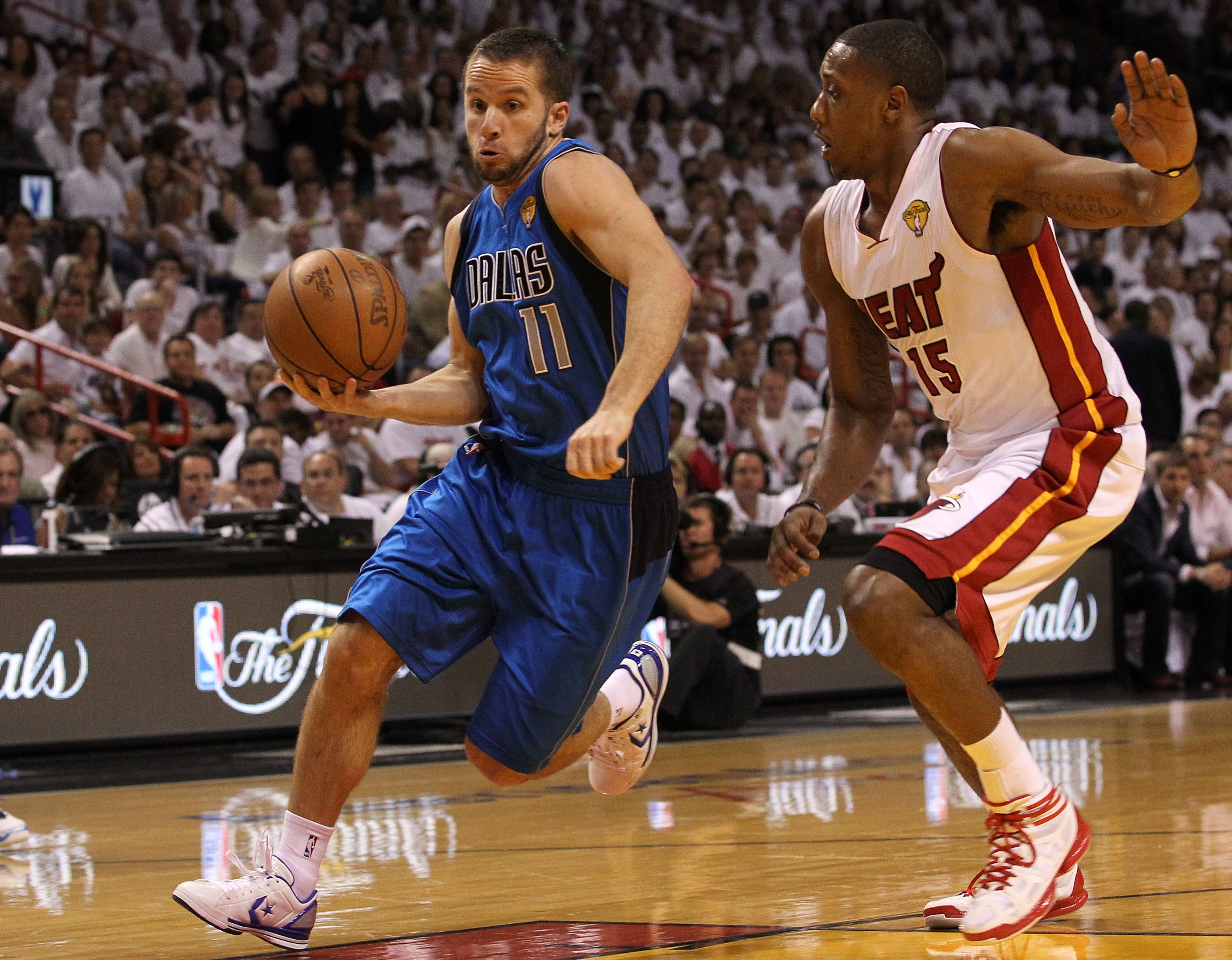 MIAMI, FL - JUNE 12:  Jose Juan Barea #11 of the Dallas Mavericks drives against Mario Chalmers #15 of the Miami Heat in Game Six of the 2011 NBA Finals at American Airlines Arena on June 12, 2011 in Miami, Florida. NOTE TO USER: User expressly acknowledg