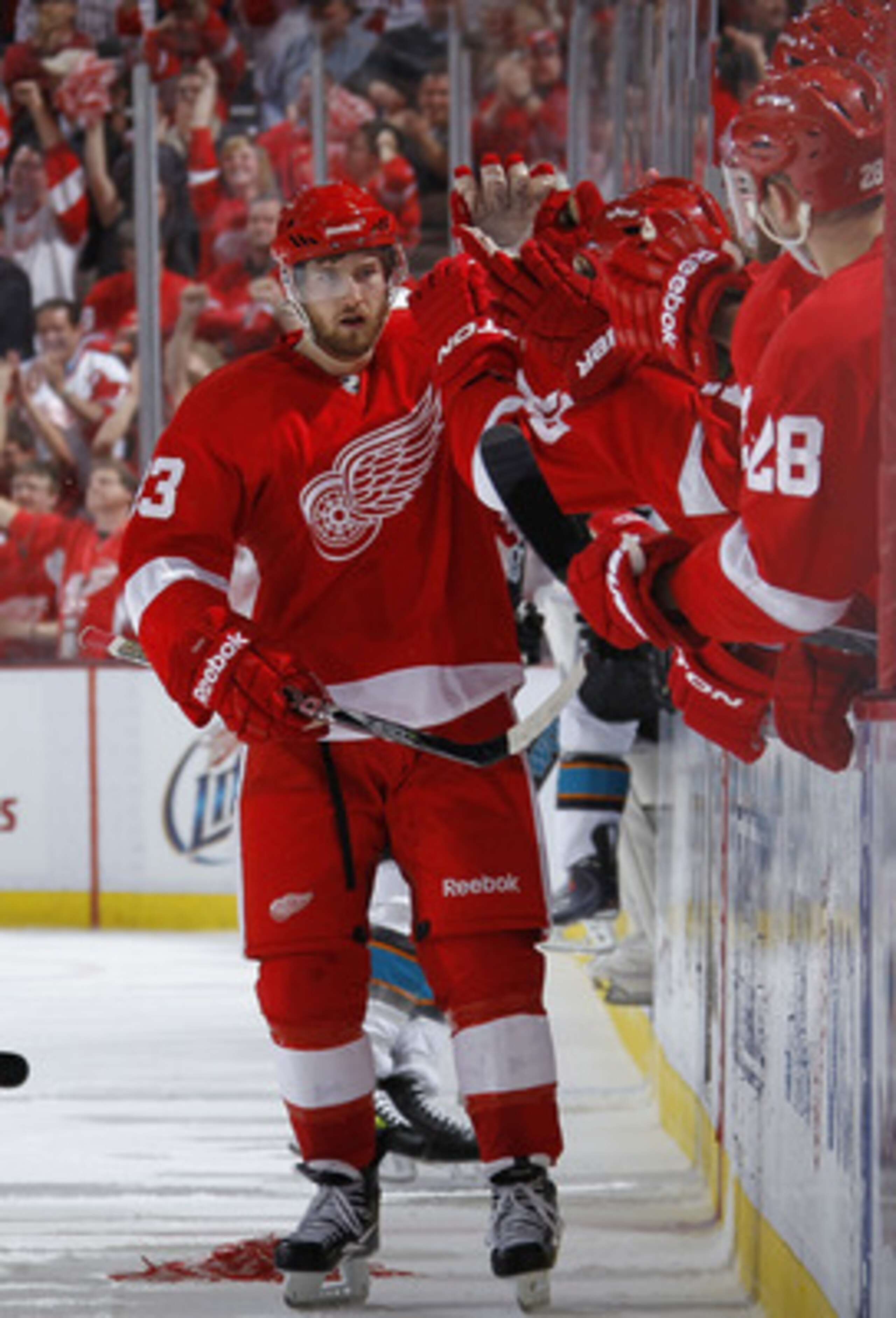 DETROIT - MAY 10: Darren Helm #43 of the Detroit Red Wings celebrates his third period empty net goal with the bench while playing the San Jose Sharks in Game Six of the Western Conference Semifinals during the 2011 NHL Stanley Cup Playoffs on May 10, 201