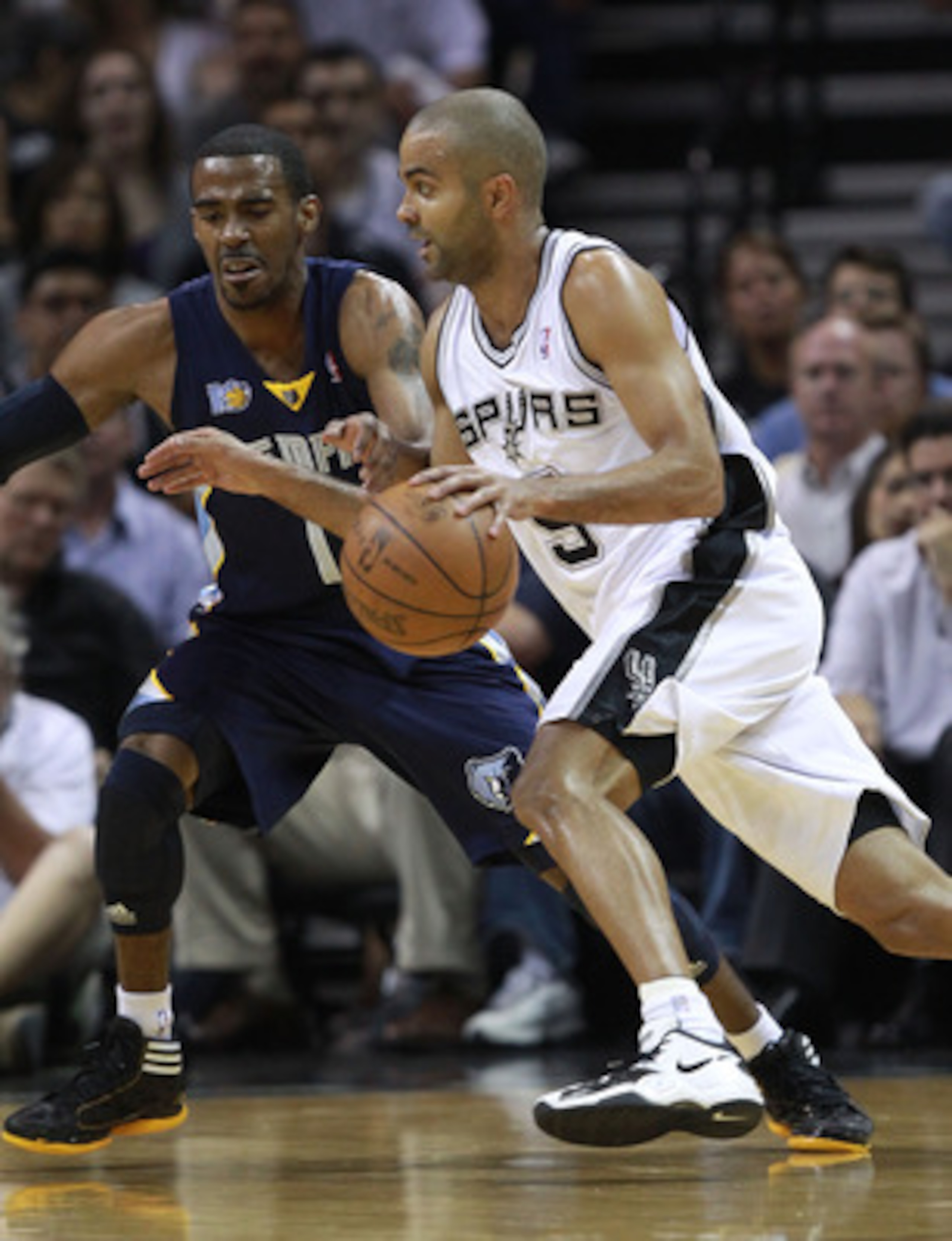 SAN ANTONIO, TX - APRIL 27:  Tony Parker #9 of the San Antionio Spurs drives against Mike Conley #11 of the Memphis Grizzlies in Game Five of the Western Conference Quarterfinals in the 2011 NBA Playoffs on April 27, 2011 at AT&T Center in San Antonio, Te