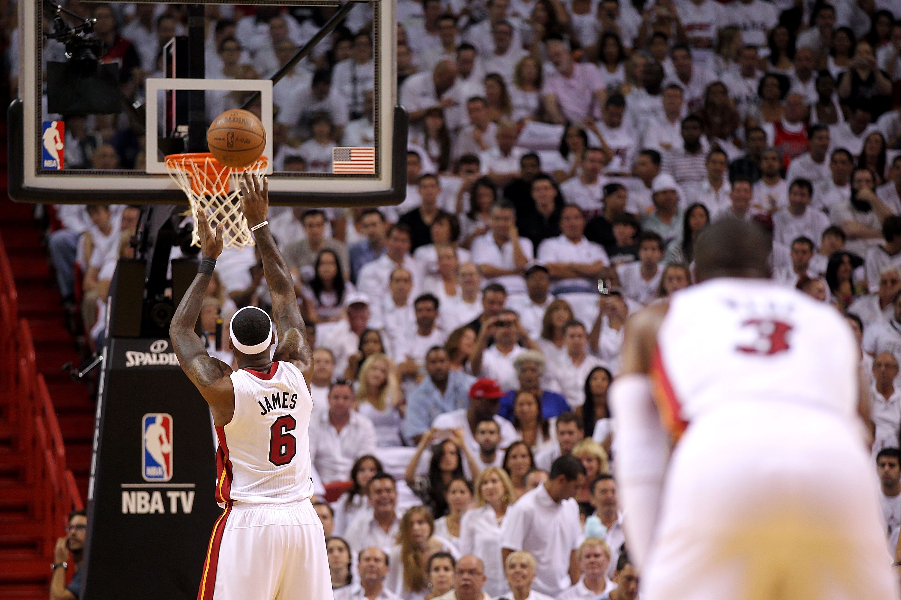 MIAMI, FL - MAY 24:  LeBron James #6 of the Miami Heat attempts a free throw as Dwyane Wade #3 looks on against the Chicago Bulls in Game Four of the Eastern Conference Finals during the 2011 NBA Playoffs on May 24, 2011 at American Airlines Arena in Miam