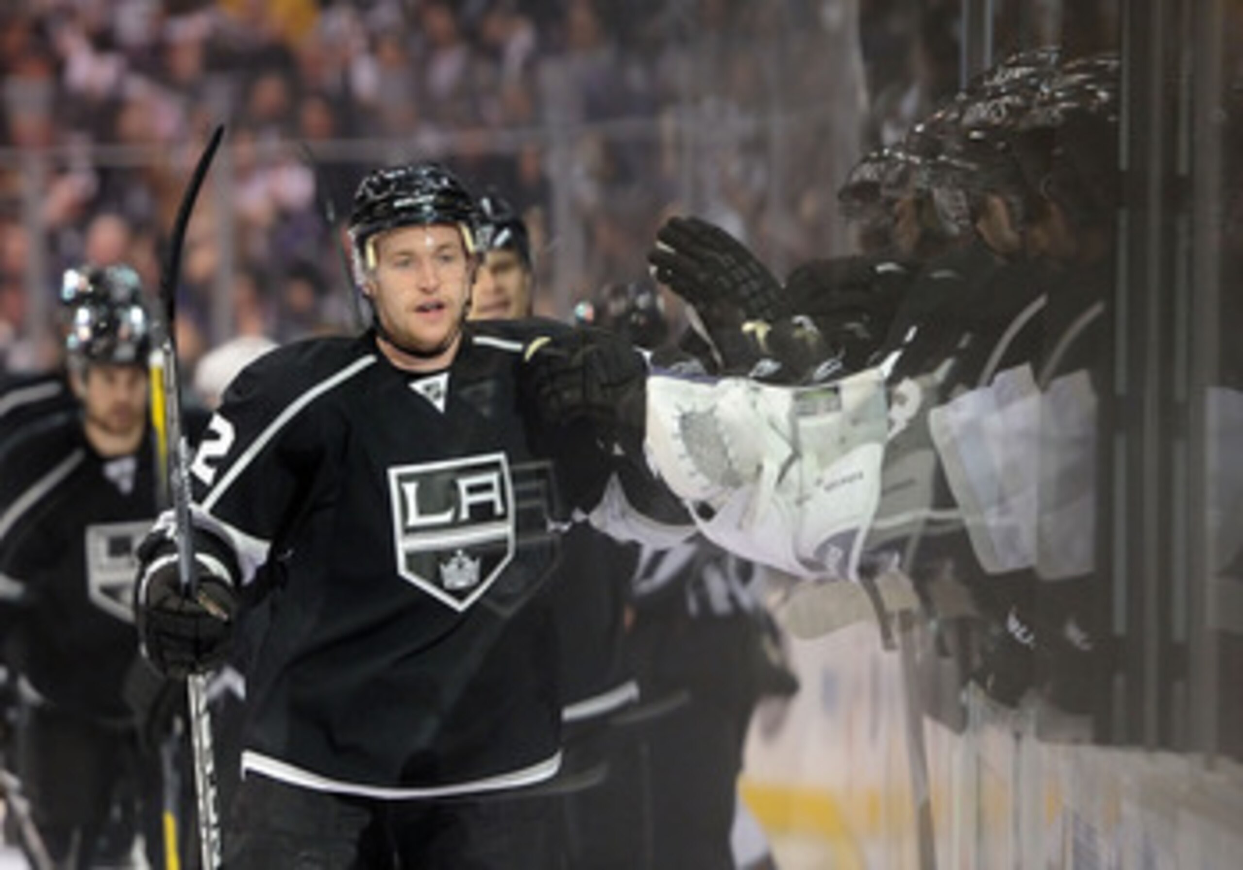 LOS ANGELES, CA - APRIL 19:  Trevor Lewis #22 of the Los Angeles Kings celebrates a goal by Willie Mitchell #33 in the first period against the San Jose Sharks in game three of the Western Conference Quarterfinals during the 2011 NHL Stanley Cup Playoffs 