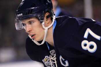 PITTSBURGH, PA - JANUARY 01:  Sidney Crosby #87 of the Pittsburgh Penguins looks on while playing against the Washington Capitals during the 2011 NHL Bridgestone Winter Classic at Heinz Field on January 1, 2011 in Pittsburgh, Pennsylvania.  (Photo by Jami