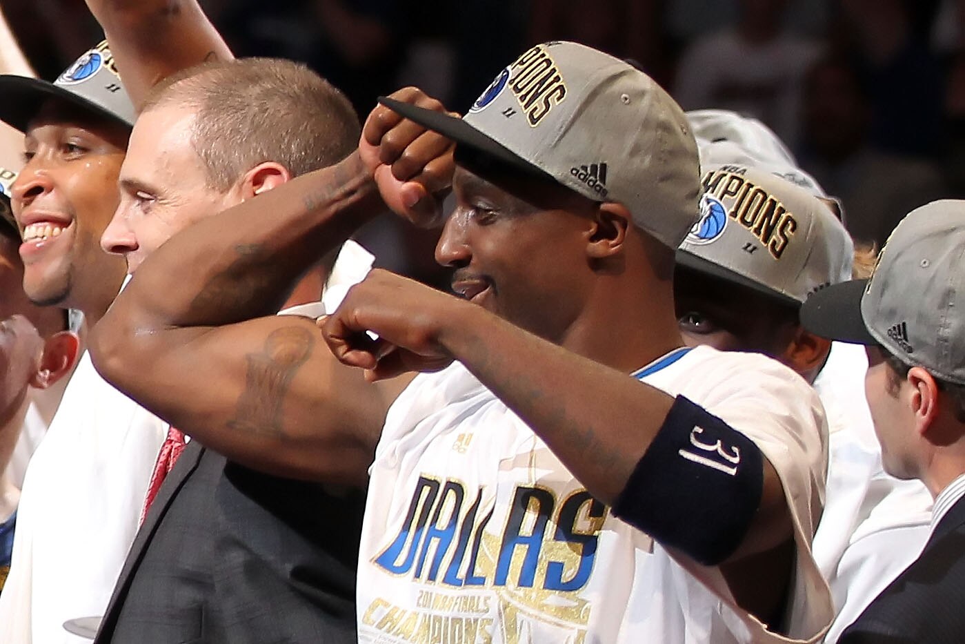 MIAMI, FL - JUNE 12:  Jason Terry #31 of the Dallas Mavericks points towards his tattoo of the Larry O'Brien trophy as he celebrates their 105-95 win against the Miami Heat in Game Six of the 2011 NBA Finals at American Airlines Arena on June 12, 2011 in