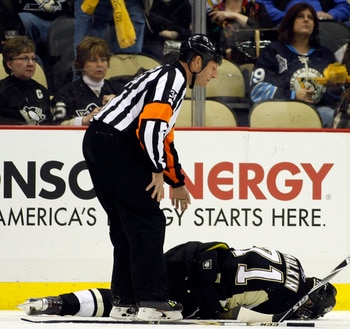 PITTSBURGH, PA - FEBRUARY 04:  Evgeni Malkin #71 of the Pittsburgh Penguins lies injured on the ice during the game against the Buffalo Sabres at Consol Energy Center on February 4, 2011 in Pittsburgh, Pennsylvania.  The Penguins defeated Buffalo 3-2.  (P