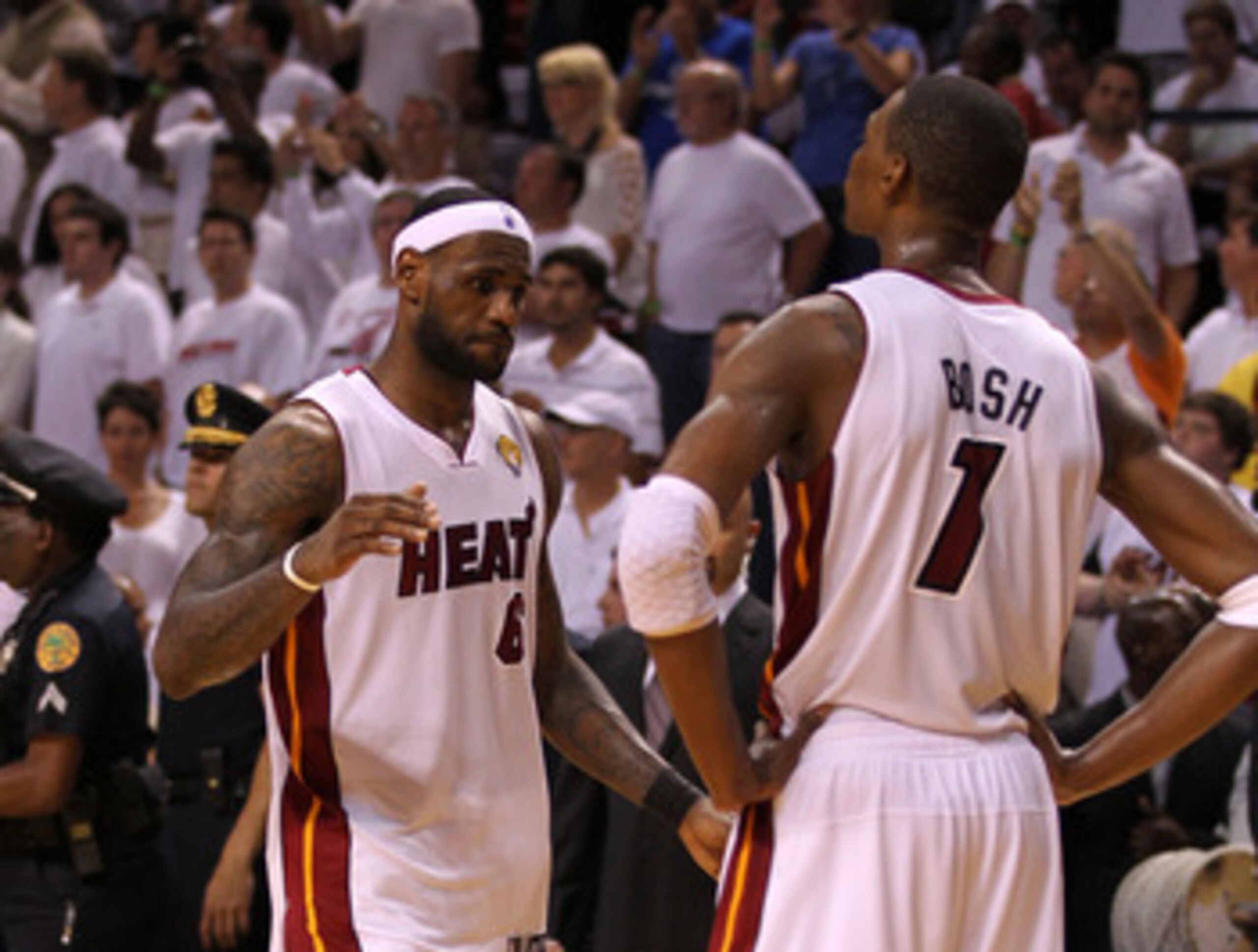 MIAMI, FL - JUNE 12:  LeBron James #6 and Chris Bosh #1 of the Miami Heat look on dejected after the Heat lost to the Dallas Mavericks 105-95 in Game Six of the 2011 NBA Finals at American Airlines Arena on June 12, 2011 in Miami, Florida. NOTE TO USER: U