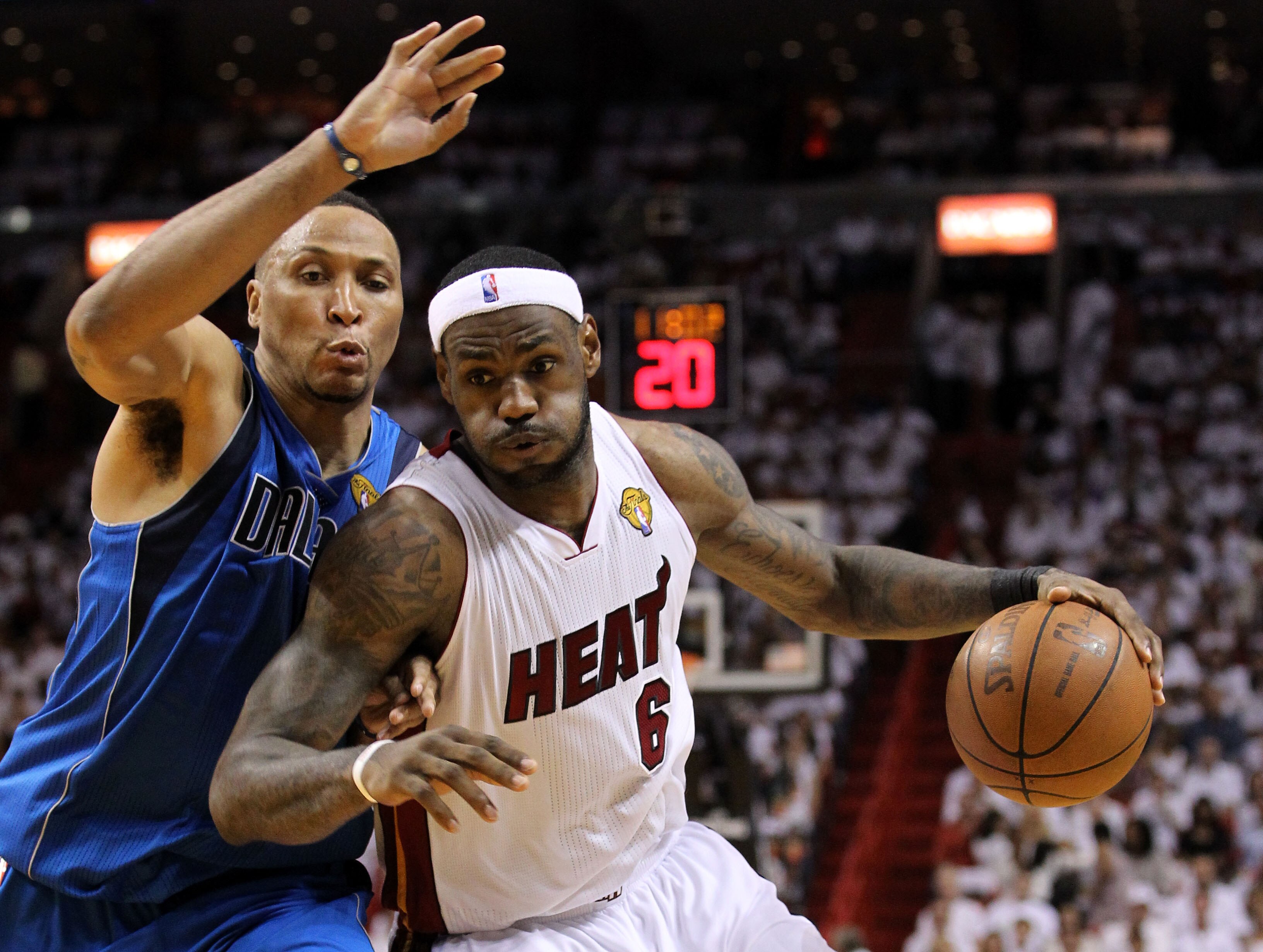 MIAMI, FL - JUNE 12:  LeBron James #6 of the Miami Heat drives against Shawn Marion #0 of the Dallas Mavericks in the third quarter of Game Six of the 2011 NBA Finals at American Airlines Arena on June 12, 2011 in Miami, Florida. NOTE TO USER: User expres