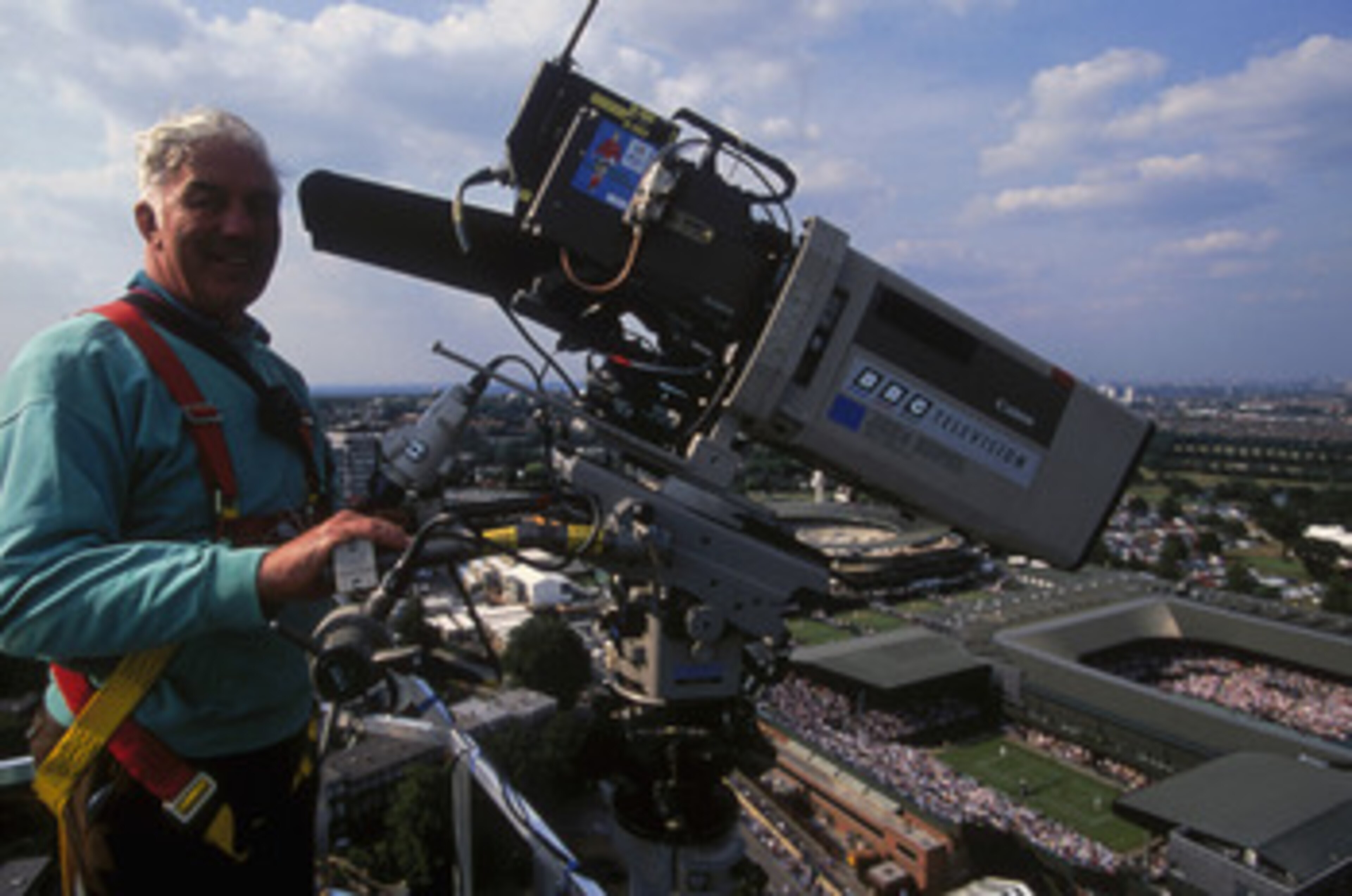 LONDON - JUNE 29:  A BBC cameraman on a skylift crane taken during the Wimbledon Lawn Tennis Championships held on June 29, 1996 at the All England Lawn Tennis and Croquet Club in London. (Photo by Mark Thompson/Getty Images)