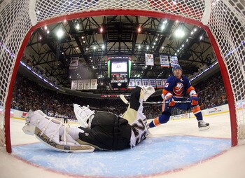UNIONDALE, NY - APRIL 08: Marc-Andre Fleury #29 of the Pittsburgh Penguins stops P.A. Parenteau #15 of the New York Islanders during teh shootout at the Nassau Coliseum on April 8, 2011 in Uniondale, New York. The Penguins defeated the Islanders 4-3 in th