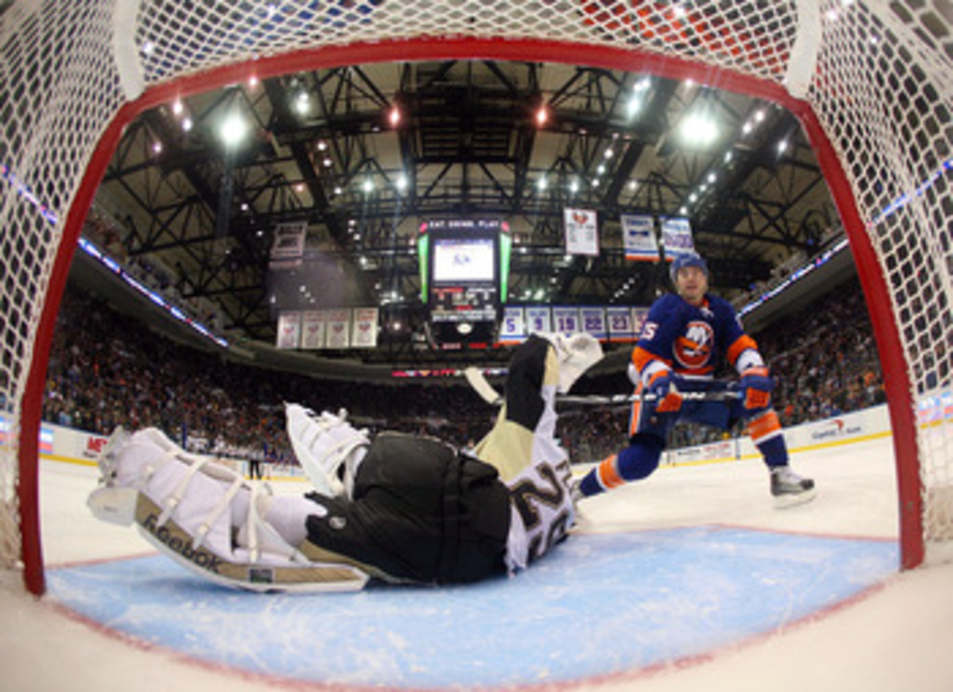 UNIONDALE, NY - APRIL 08: Marc-Andre Fleury #29 of the Pittsburgh Penguins stops P.A. Parenteau #15 of the New York Islanders during teh shootout at the Nassau Coliseum on April 8, 2011 in Uniondale, New York. The Penguins defeated the Islanders 4-3 in th UNIONDALE, NY - APRIL 08: Marc-Andre Fleury #29 of the Pittsburgh Penguins stops P.A. Parenteau #15 of the New York Islanders during teh shootout at the Nassau Coliseum on April 8, 2011 in Uniondale, New York. The Penguins defeated the Islanders 4-3 in th