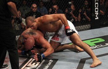 DALLAS - SEPTEMBER 19:  UFC fighter Mirko Cro Cop (L) is stopped by referee after losing to opponent UFC fighter Junior Dos Santo (R) during their Heavyweight bout at UFC 103: Franklin vs. Belfort at the American Airlines Center on September 19, 2009 in D