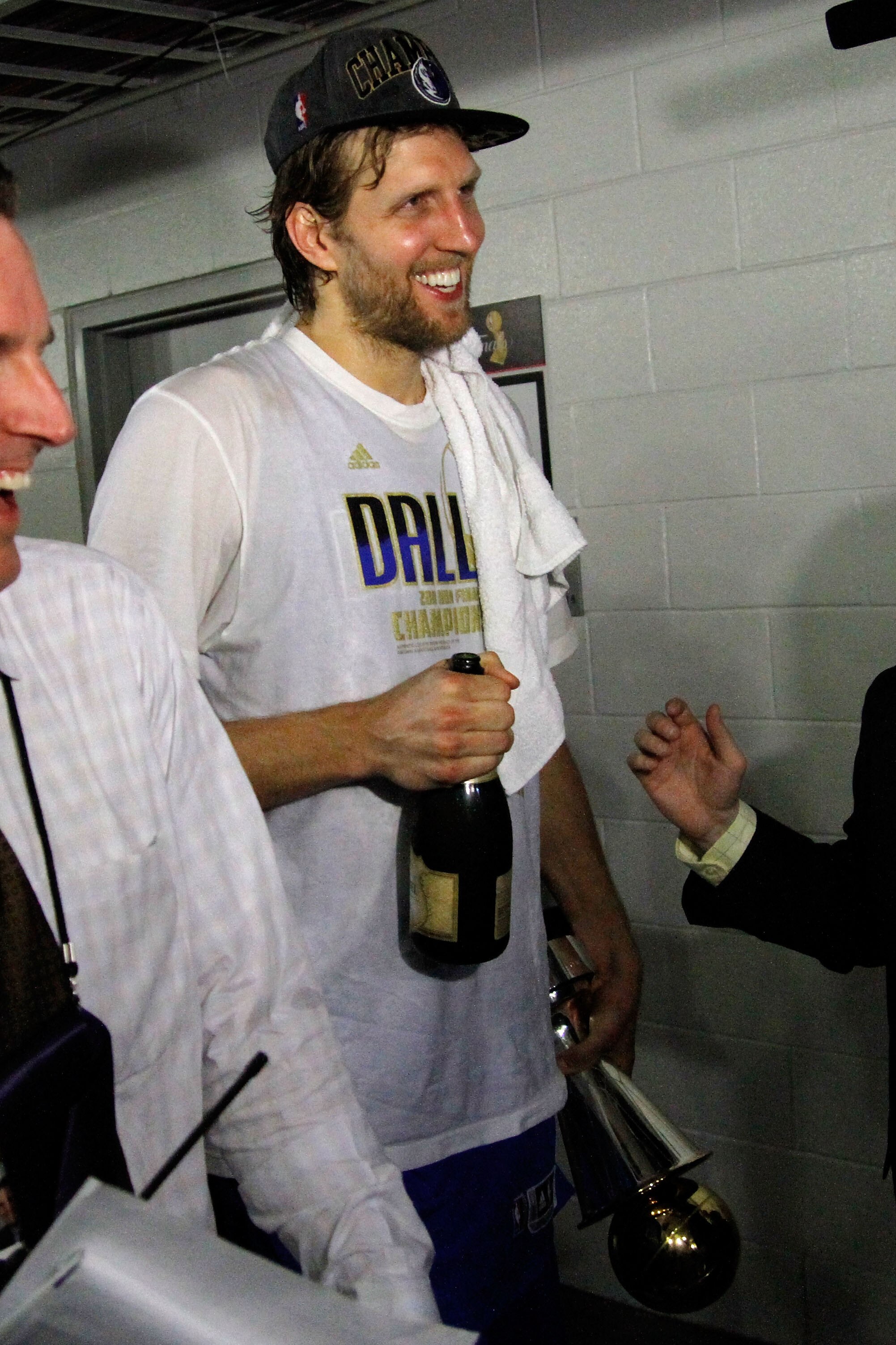 MIAMI, FL - JUNE 12:  Dirk Nowitzki #41 of the Dallas Mavericks walks through the halls of the arena with the Bill Russell Finals MVP trophy after the Maveircks won 105-95 against the Miami Heat in Game Six of the 2011 NBA Finals at American Airlines Aren