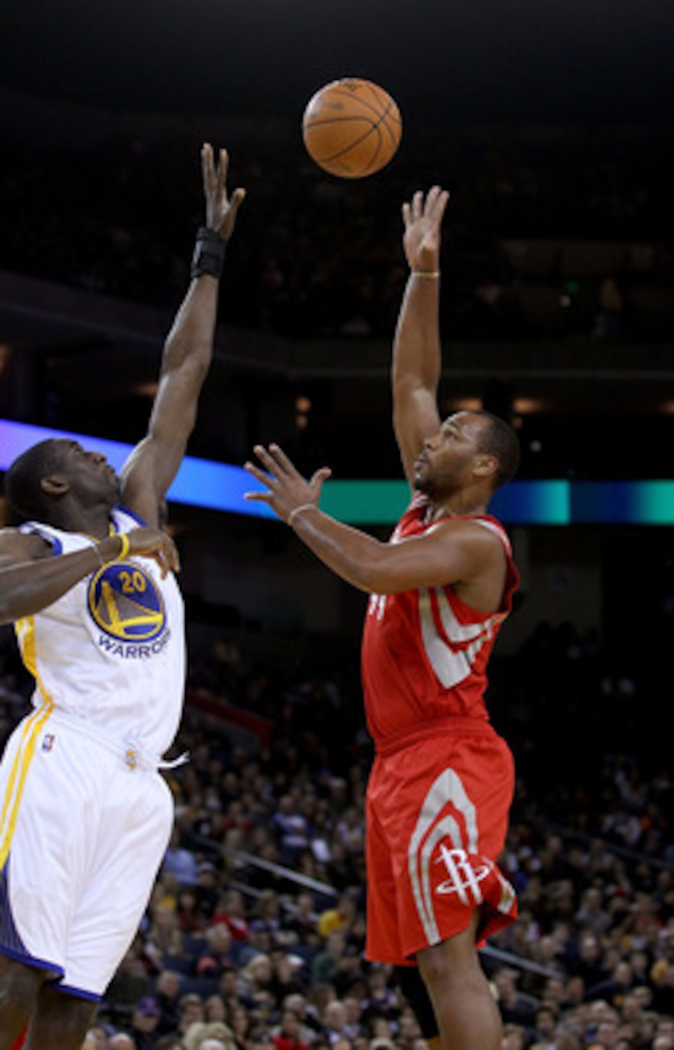 OAKLAND, CA - DECEMBER 20:  Chuck Hayes #44 of the Houston Rockets shoots over Ekpe Udoh #20 the Golden State Warriors at Oracle Arena on December 20, 2010 in Oakland, California. NOTE TO USER: User expressly acknowledges and agrees that, by downloading a