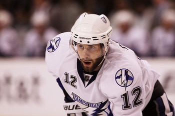 BOSTON, MA - MAY 17:  Simon Gagne #12 of the Tampa Bay Lightning looks on in Game Two of the Eastern Conference Finals against the Boston Bruins during the 2011 NHL Stanley Cup Playoffs at TD Garden on May 17, 2011 in Boston, Massachusetts.  (Photo by Bru