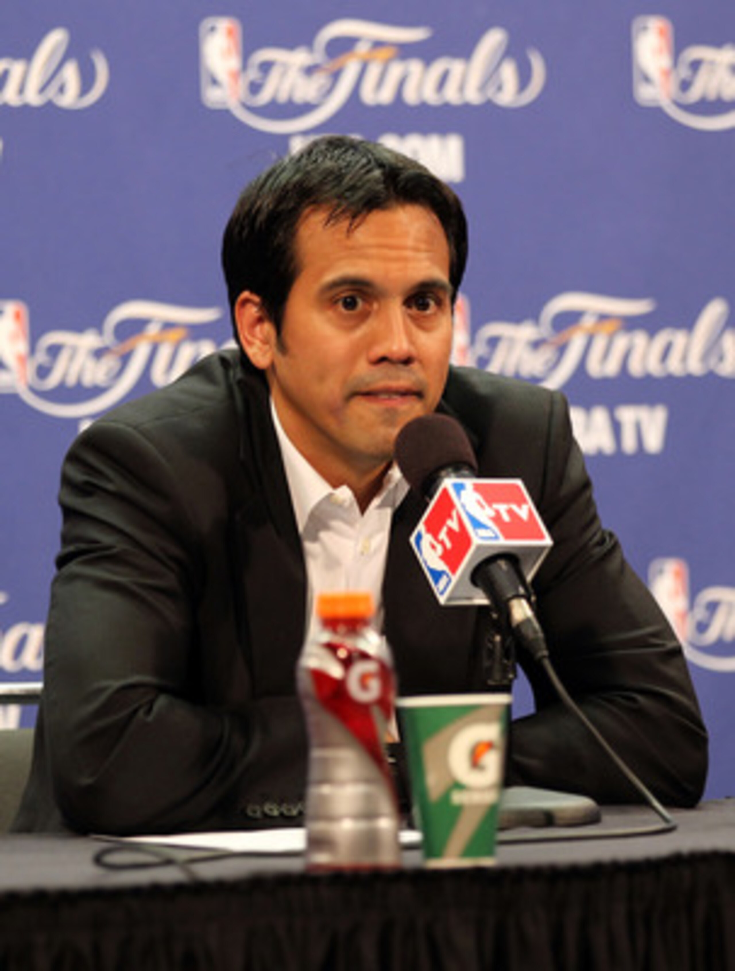MIAMI, FL - JUNE 12: Head coach Erik Spoelstra of the Miami Heat answers questions from the media after the Dallas Mavericks won 105-95 in Game Six of the 2011 NBA Finals at American Airlines Arena on June 12, 2011 in Miami, Florida. NOTE TO USER: User e MIAMI, FL - JUNE 12: Head coach Erik Spoelstra of the Miami Heat answers questions from the media after the Dallas Mavericks won 105-95 in Game Six of the 2011 NBA Finals at American Airlines Arena on June 12, 2011 in Miami, Florida. NOTE TO USER: User e