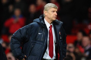 MANCHESTER, ENGLAND - MARCH 12:  Arsenal manager Arsene Wenger looks dejected after defeat in the FA Cup sponsored by E.On Sixth Round match between Manchester United and Arsenal at Old Trafford on March 12, 2011 in Manchester, England.  (Photo by Clive M