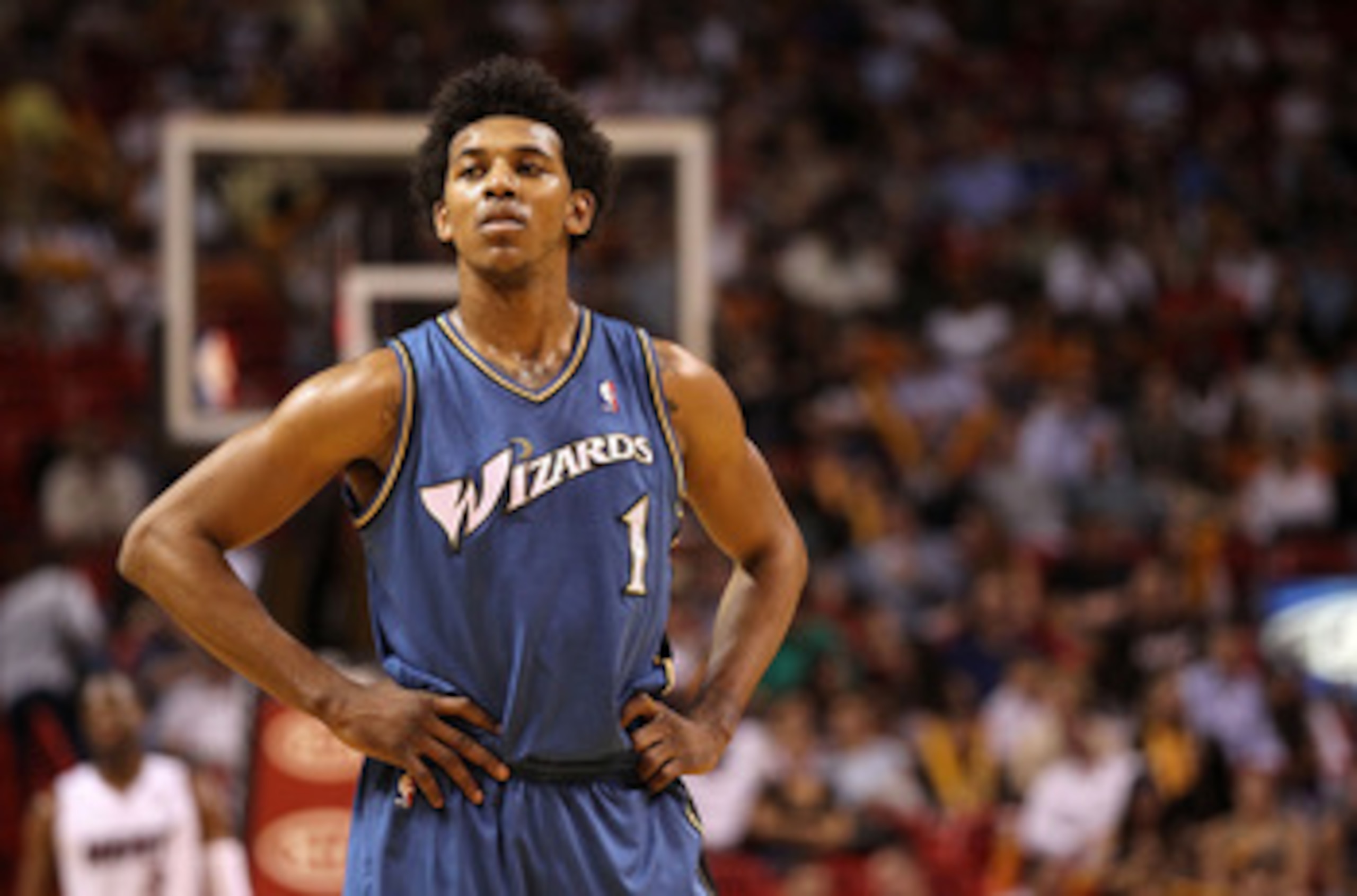 MIAMI, FL - FEBRUARY 25: Nick Young #1 of the Washington Wizards looks on during a pause in the game against the Miami Heat at American Airlines Arena on February 25, 2011 in Miami, Florida. NOTE TO USER: User expressly acknowledges and agrees that, by MIAMI, FL - FEBRUARY 25: Nick Young #1 of the Washington Wizards looks on during a pause in the game against the Miami Heat at American Airlines Arena on February 25, 2011 in Miami, Florida. NOTE TO USER: User expressly acknowledges and agrees that, by