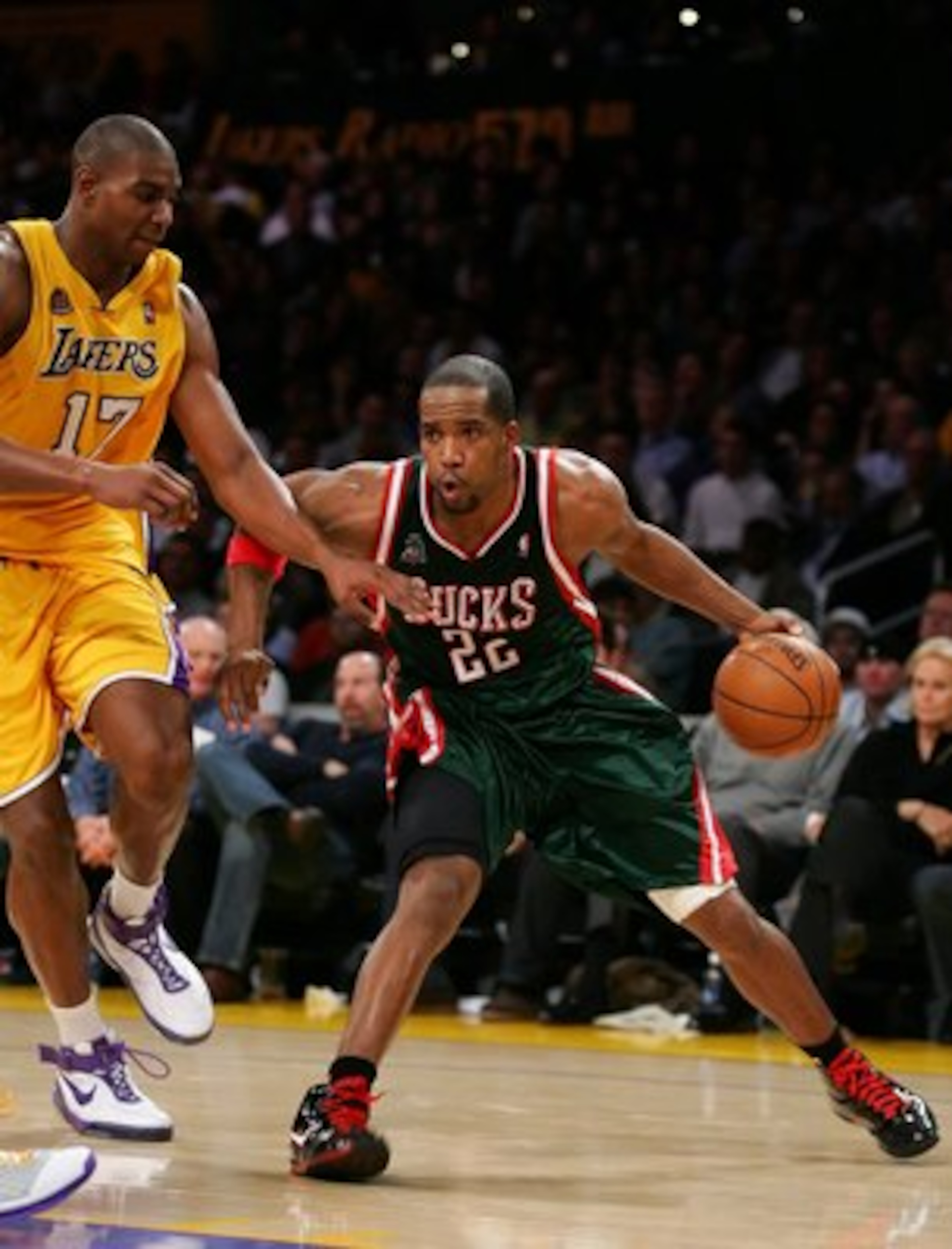 LOS ANGELES, CA - JANUARY 11:   Michael Redd #22 of the Milwaukee Bucks drives against Andrew Bynum #17 of the Los Angeles Lakers at Staples Center on January 11, 2008 in Los Angeles, California.  NOTE TO USER: User expressly acknowledges and agrees that,