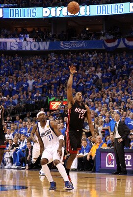 DALLAS, TX - JUNE 09:  Mario Chalmers #15 of the Miami Heat makes a 3-point basket at the buzzer of the end of the first quarter against the Jason Terry #31 of the Dallas Mavericks in Game Five of the 2011 NBA Finals at American Airlines Center on June 9,