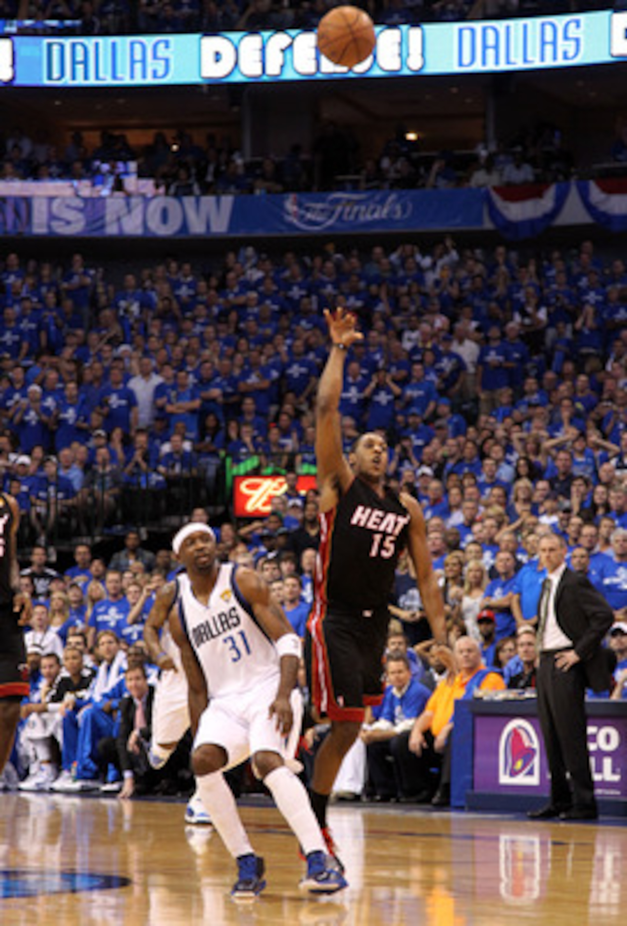 DALLAS, TX - JUNE 09:  Mario Chalmers #15 of the Miami Heat makes a 3-point basket at the buzzer of the end of the first quarter against the Jason Terry #31 of the Dallas Mavericks in Game Five of the 2011 NBA Finals at American Airlines Center on June 9,