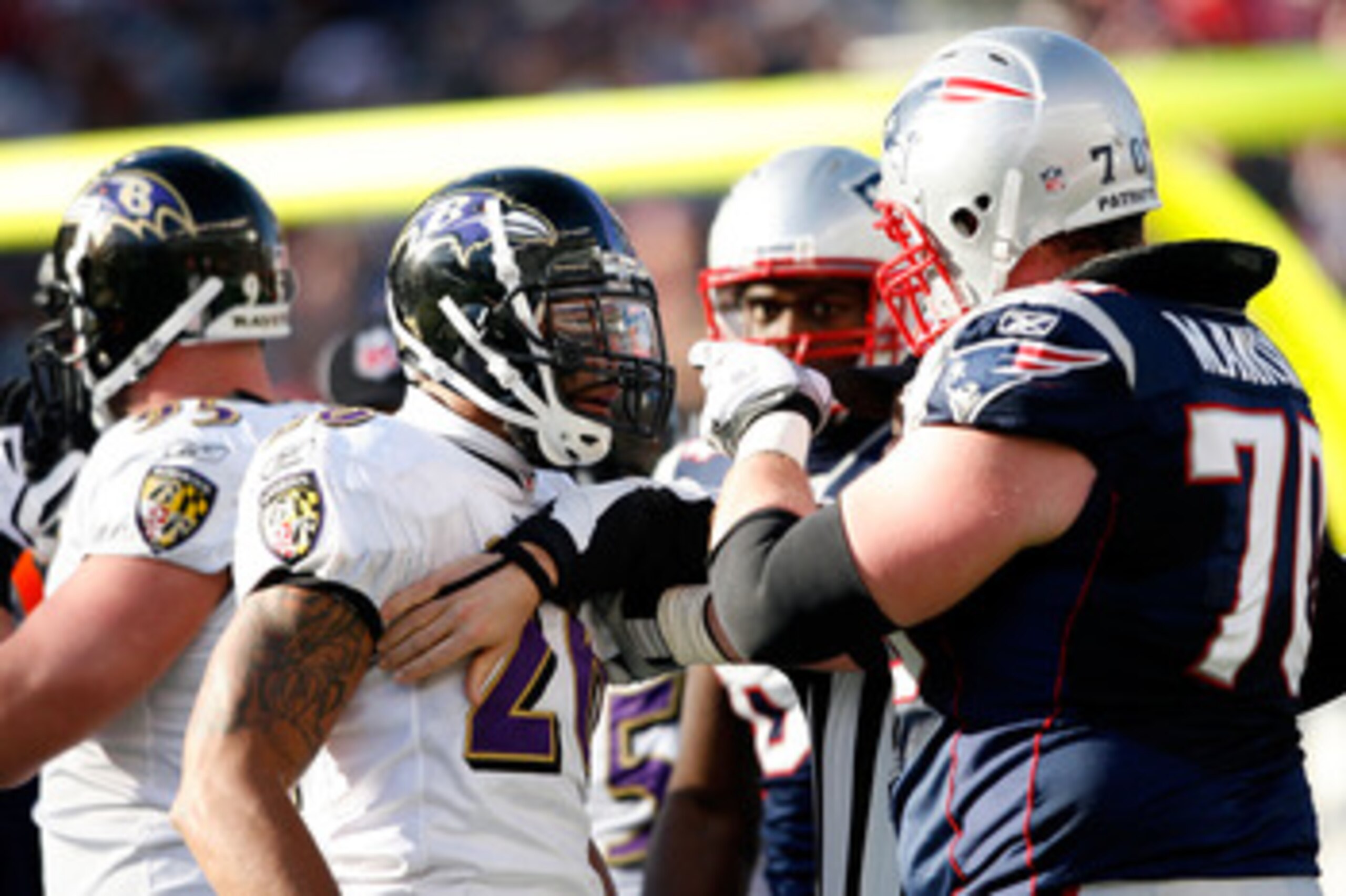 FOXBORO, MA - JANUARY 10:  Logan Mankins #70 of the New England Patriots and Ed Reed #20 of  the Baltimore Ravens get in each others face during the 2010 AFC wild-card playoff game at Gillette Stadium on January 10, 2010 in Foxboro, Massachusetts.  (Photo