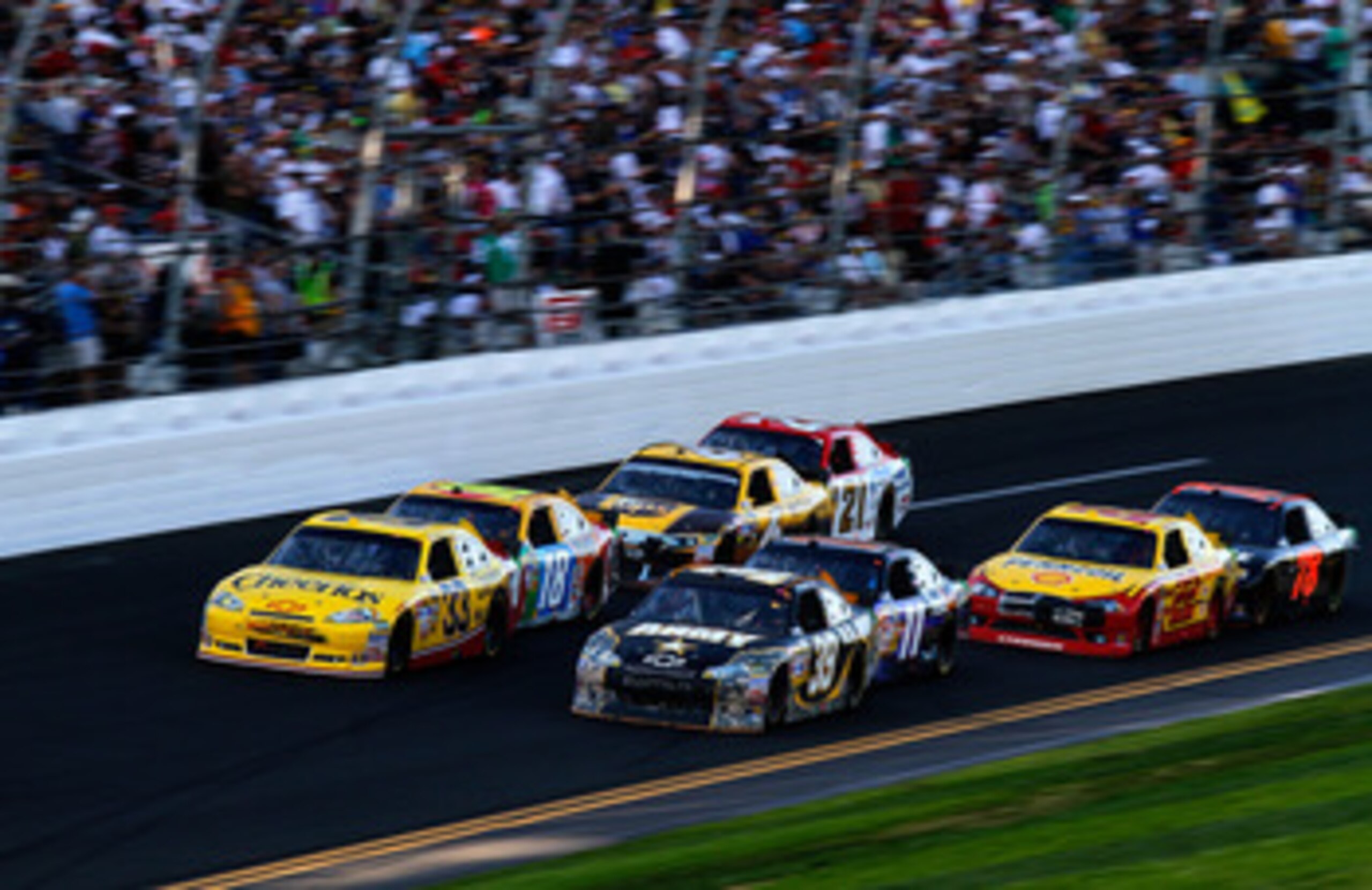 DAYTONA BEACH, FL - FEBRUARY 20:  Clint Bowyer, driver of the #33 Cheerios Chevrolet,  and Ryan Newman, driver of the #39 U.S. Army Chevrolet, lead a group of cars during the NASCAR Sprint Cup Series Daytona 500 at Daytona International Speedway on Februa