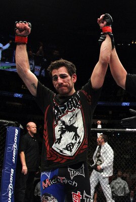 PHILADELPHIA - AUGUST 08:   Lightweight champion BJ Penn (R) battles Kenny Florian during their lightweight championship title bout at UFC 101: Declaration at the Wachovia Center on August 8, 2009 in Philadelphia, Pennsylvania.  (Photo by Jon Kopaloff/Get