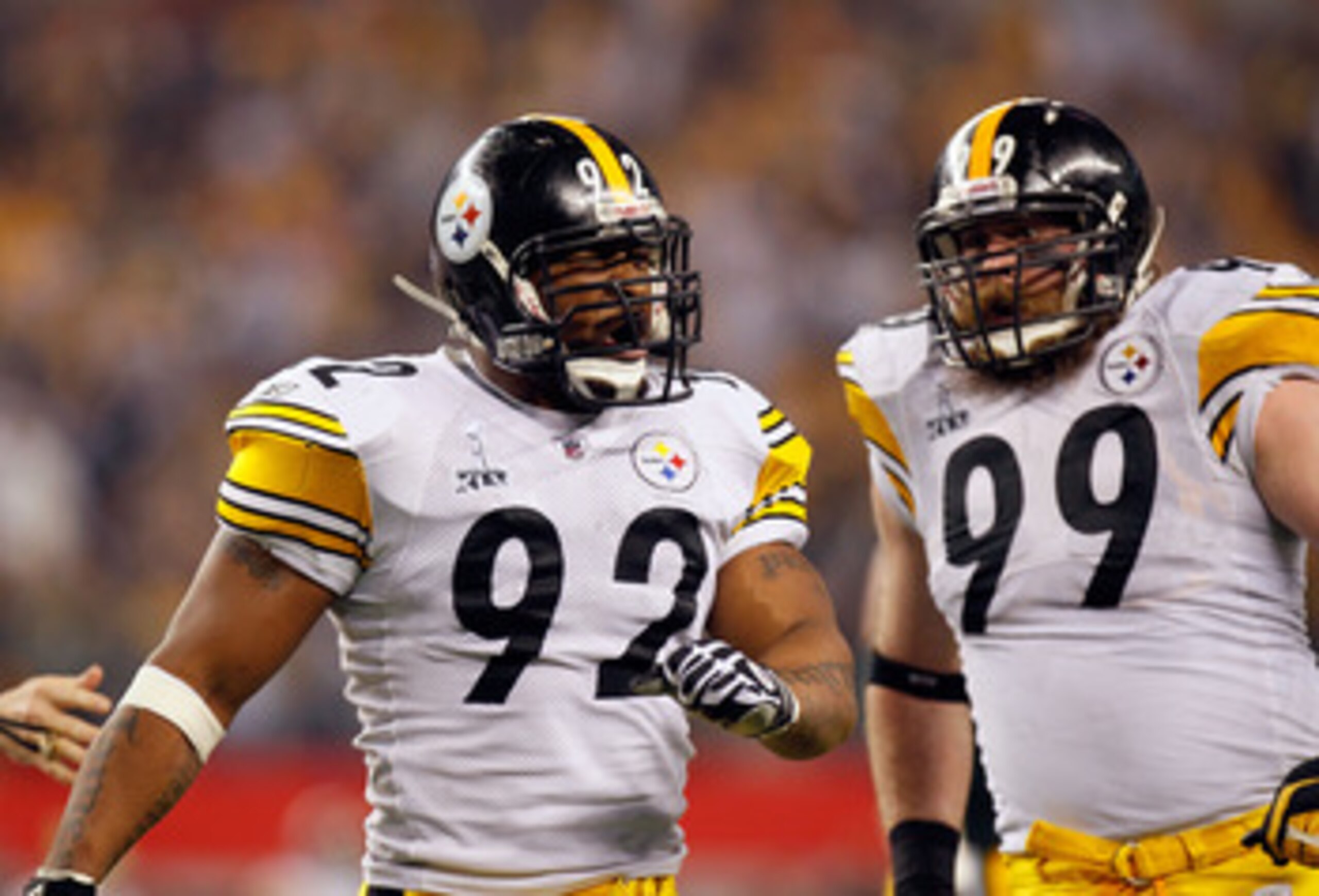 ARLINGTON, TX - FEBRUARY 06:   James Harrison #92 and Brett Keisel #99 of the Pittsburgh Steelers celebrate a defensive play against the Green Bay Packers during Super Bowl XLV at Cowboys Stadium on February 6, 2011 in Arlington, Texas. The Packers won 31