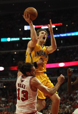 CHICAGO, IL - APRIL 26: Joakim Noah #13 of the Chicago Bulls fouls Mike Dunleavy #17 of the Indiana Pacers as he shoots in Game Five of the Eastern Conference Quarterfinals in the 2011 NBA Playoffs at the United Center on April 26, 2011 in Chicago, Illino