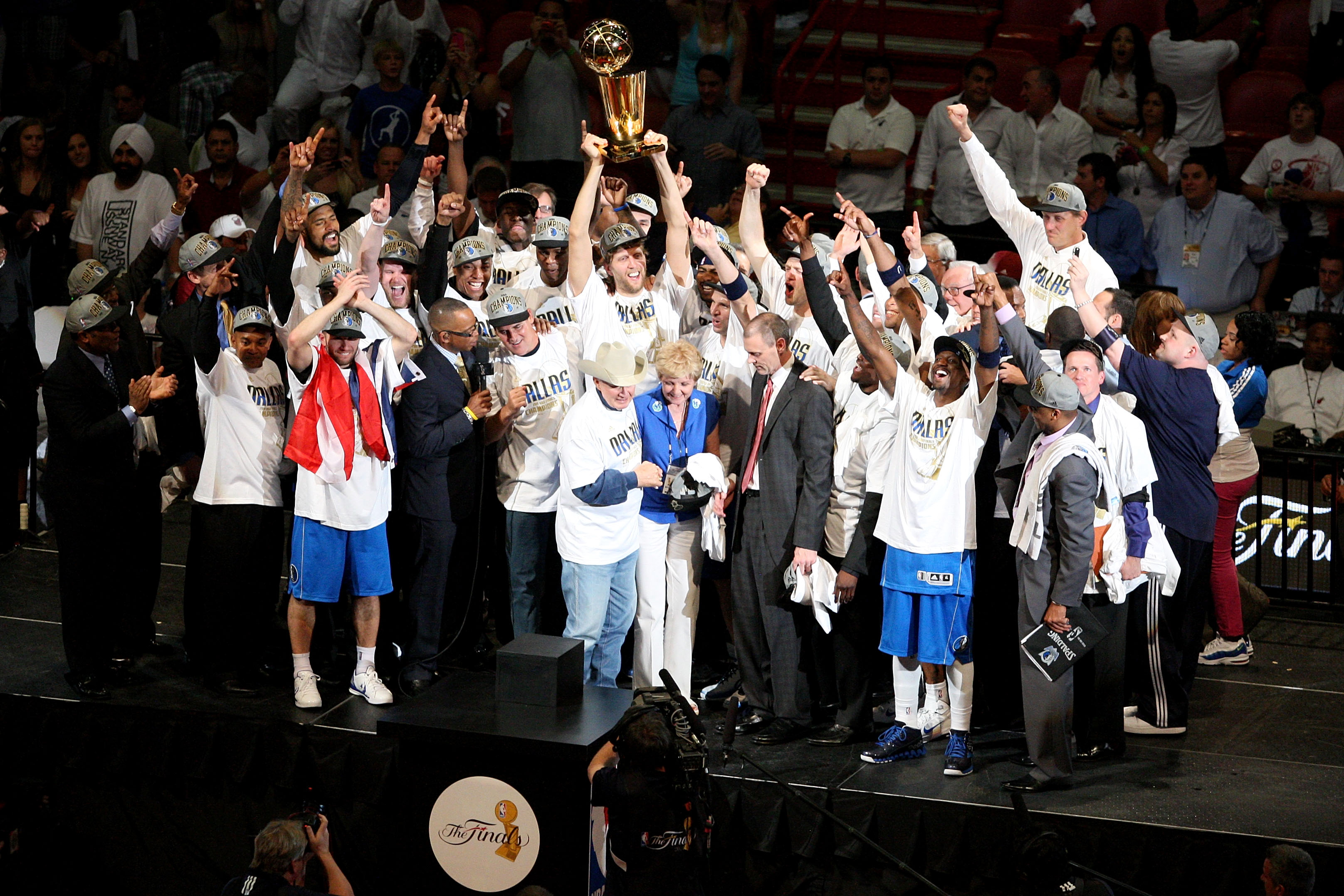 MIAMI, FL - JUNE 12:  (L-R) Jaosn Kidd #2, team owner Mark Cuban and finals MVP Dirk Nowitzki #41 of the Dallas Mavericks celebrate after they won 105-95 against the Miami Heat in Game Six of the 2011 NBA Finals at American Airlines Arena on June 12, 2011