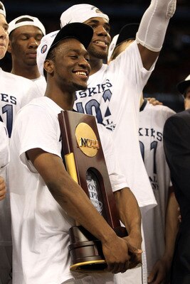 HOUSTON, TX - APRIL 04:  Kemba Walker #15 of the Connecticut Huskies celebrates with the trophy after defeating the Butler Bulldogs to win the National Championship Game of the 2011 NCAA Division I Men's Basketball Tournament by a score of 53-41 at Relian