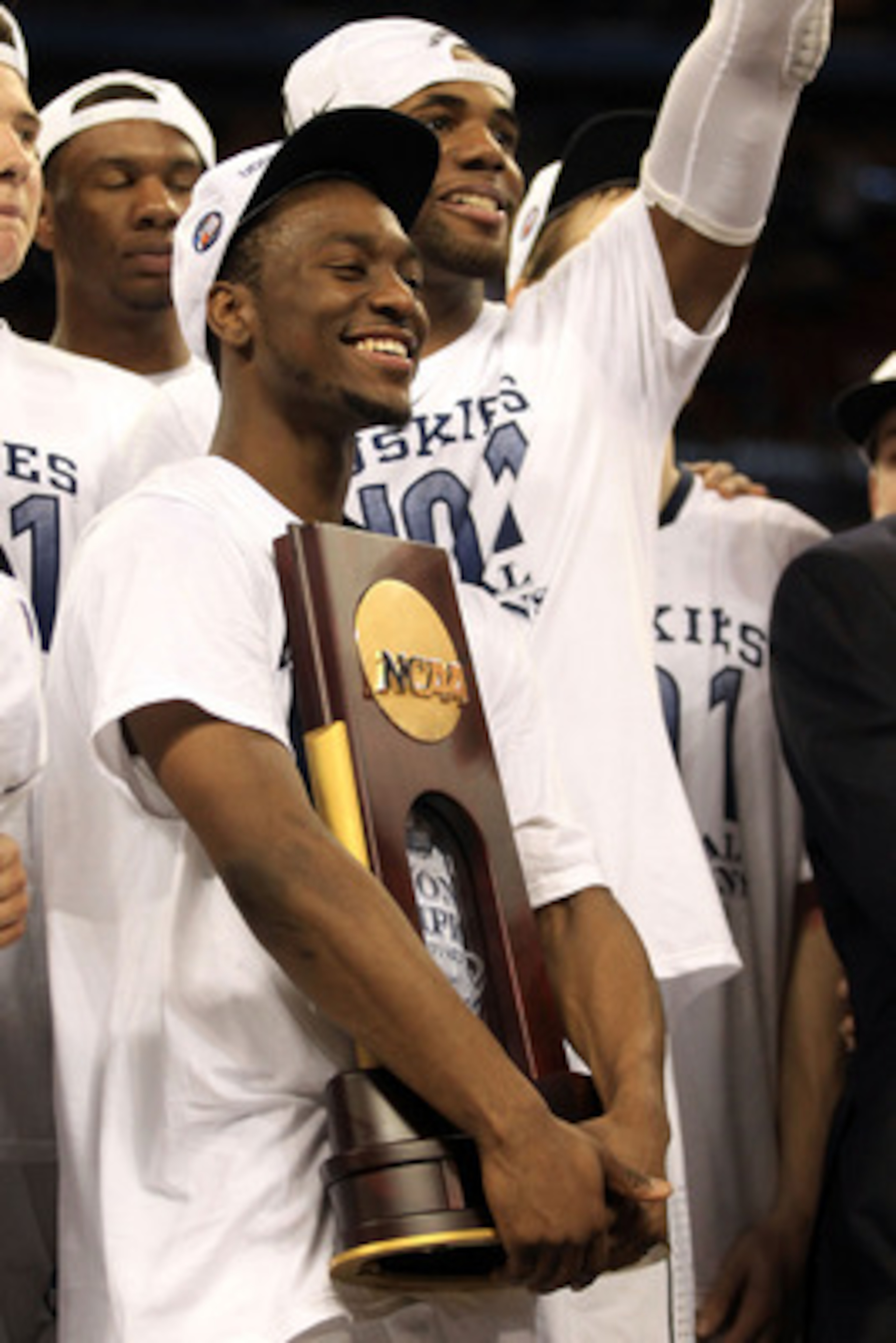 HOUSTON, TX - APRIL 04:  Kemba Walker #15 of the Connecticut Huskies celebrates with the trophy after defeating the Butler Bulldogs to win the National Championship Game of the 2011 NCAA Division I Men's Basketball Tournament by a score of 53-41 at Relian