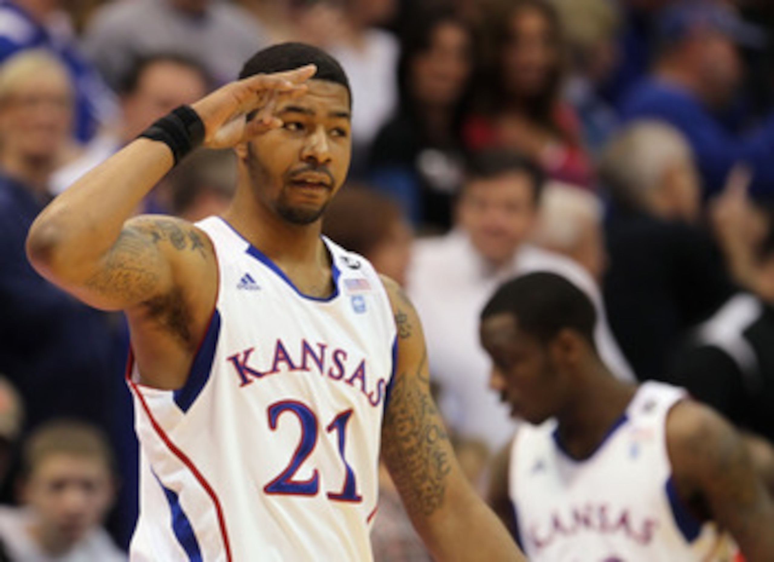 LAWRENCE, KS - FEBRUARY 12:  Markieff Morris #21 of the Kansas Jayhawks slautes the crowd during the game against the Iowa State Cyclones on February 12, 2011 at Allen Fieldhouse in Lawrence, Kansas.  (Photo by Jamie Squire/Getty Images)