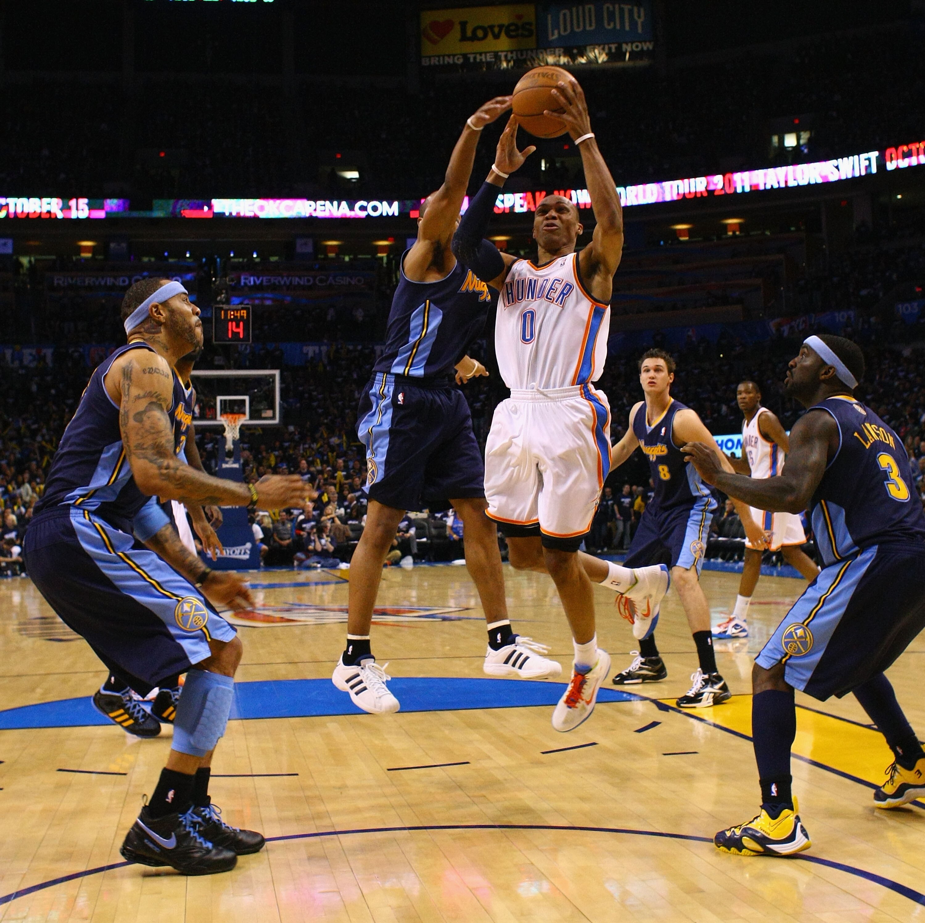 OKLAHOMA CITY, OK - APRIL 27: Russell Westbrook #0 of the Oklahoma City Thunder pulls down a rebound against the Denver Nuggets in Game Five of the Western Conference Quarterfinals in the 2011 NBA Playoffs on April 27, 2011 at the Ford Center in Oklahoma