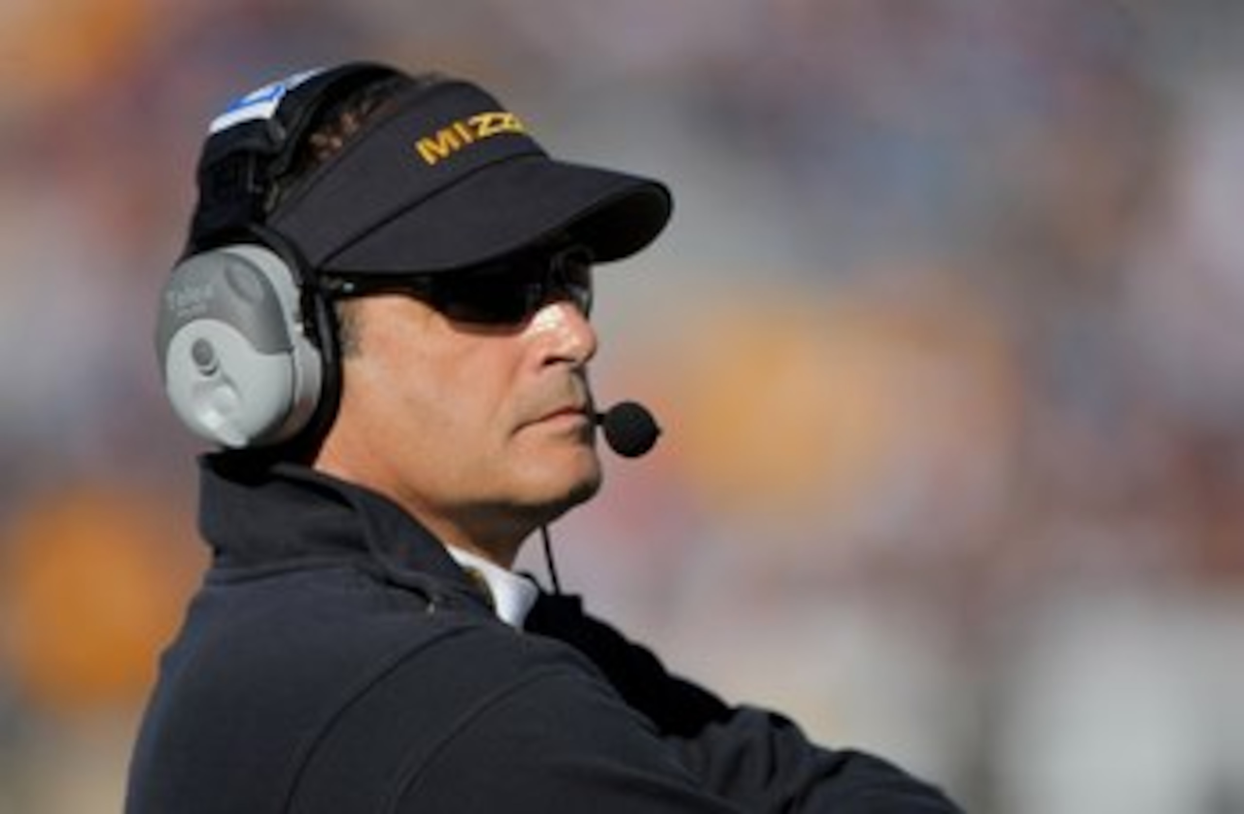 BOULDER, CO - OCTOBER 31:  Head coach Gary Pinkel of the Missouri Tigers leads his team against the Colorado Buffaloes at Folsom Field on October 31, 2009 in Boulder, Colorado. Missouri defeated Colorado 36-17.  (Photo by Doug Pensinger/Getty Images)