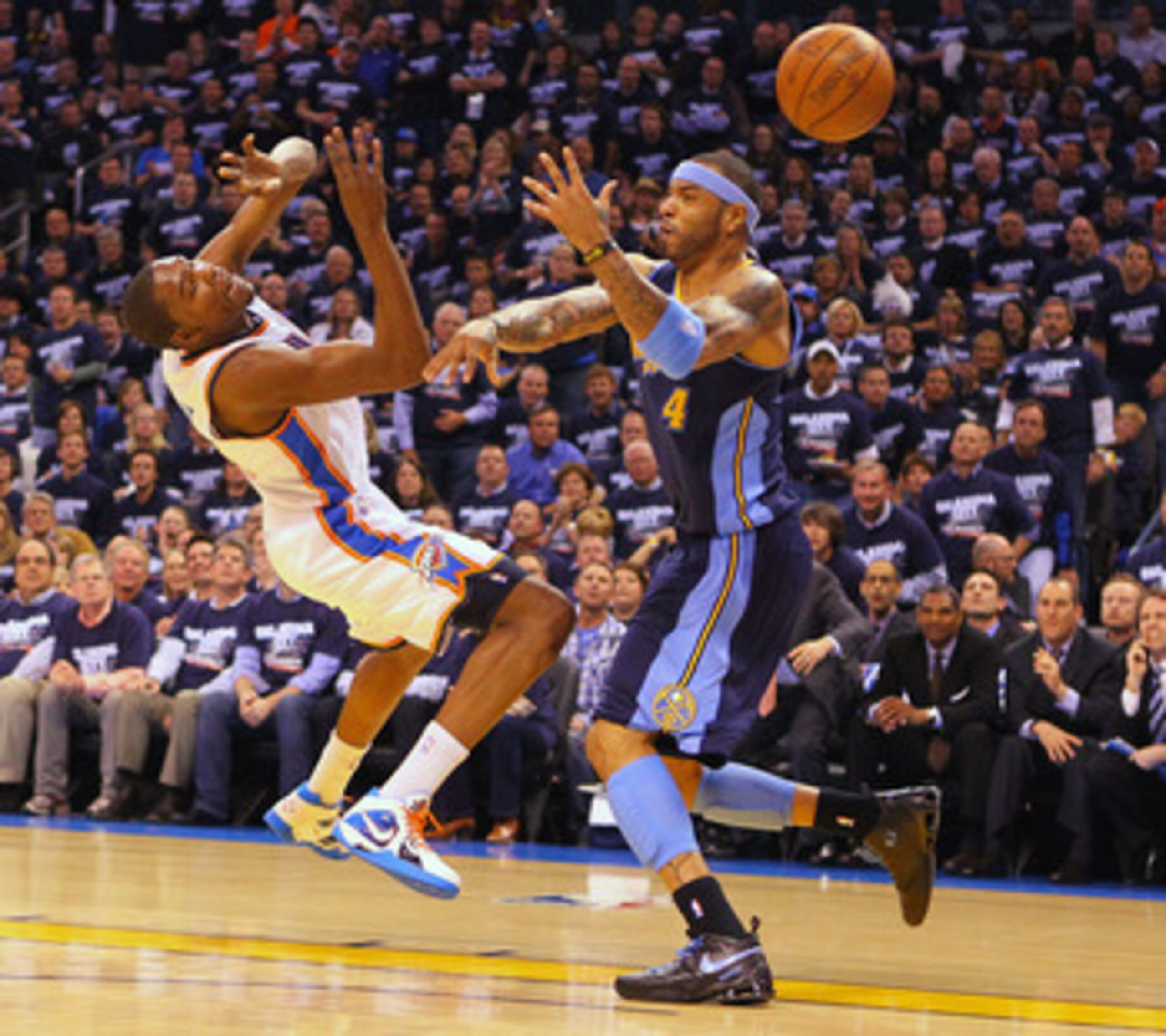 OKLAHOMA CITY, OK - APRIL 27: Kenyon Martin #4 of the Denver Nuggets knocks the ball out of the hands of Kevin Durant #35 of the Oklahoma City Thunder in Game Five of the Western Conference Quarterfinals in the 2011 NBA Playoffs on April 27, 2011 at the F