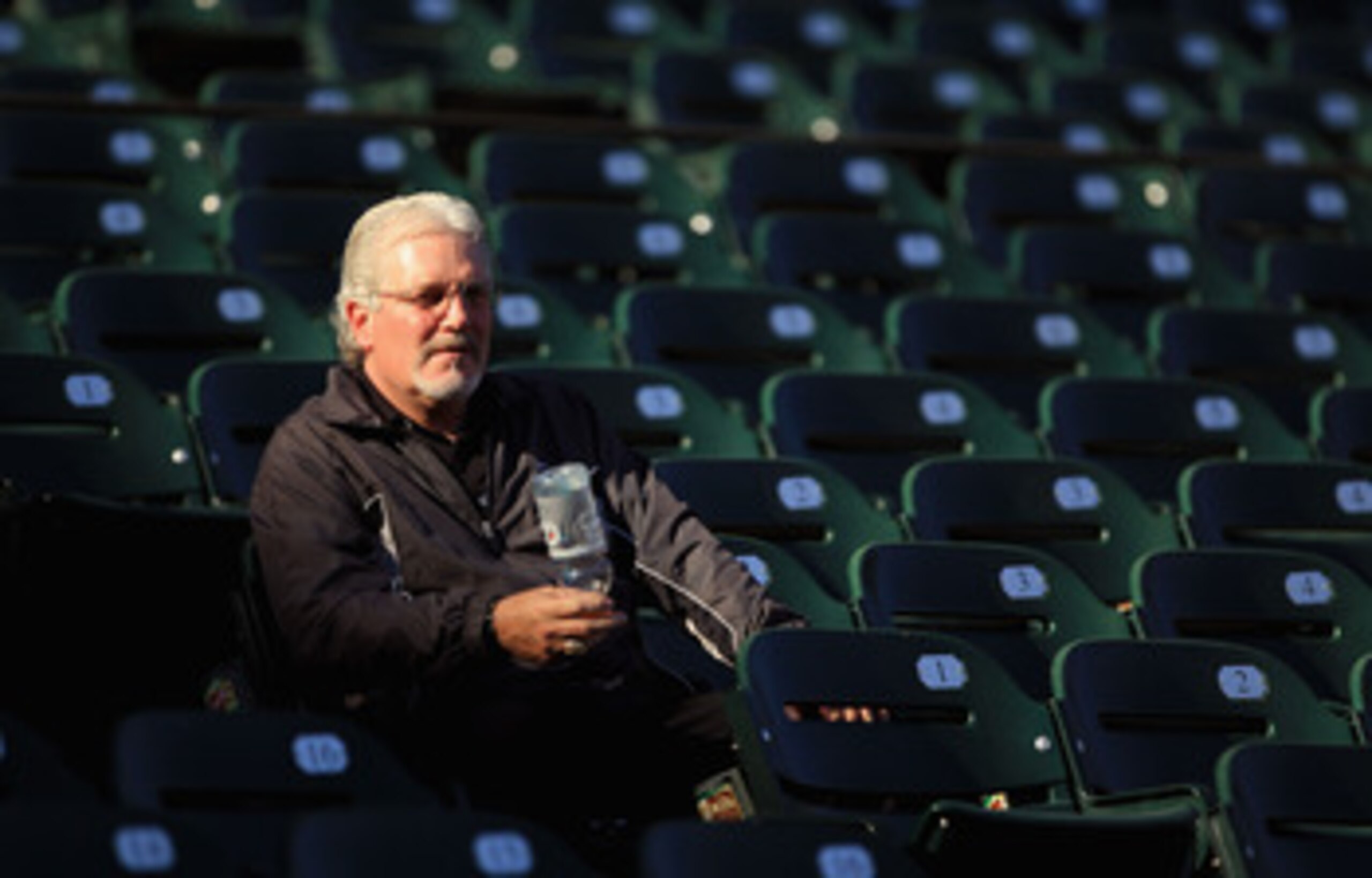 SAN FRANCISCO - OCTOBER 13:  San Francisco Giants general manager Brian Sabean sits in the stands during a workout session in preparation for the National League Championship Series at AT&T Park on October 13, 2010 in San Francisco, California.  (Photo by