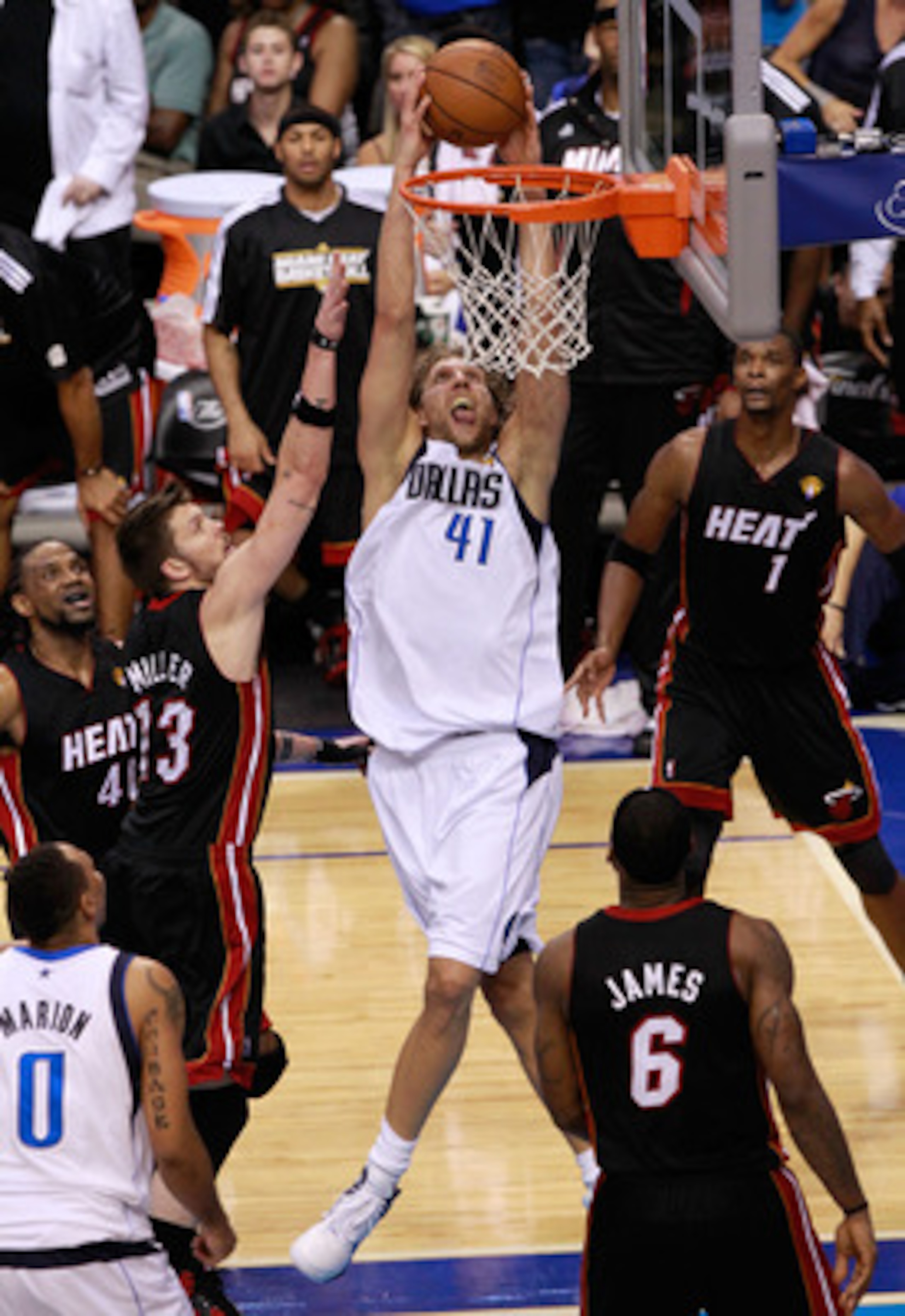 DALLAS, TX - JUNE 09:  Dirk Nowitzki #41 of the Dallas Mavericks dunks against Mike Miller #13 and LeBron James #6 of the Miami Heat late in the fourth quarter in Game Five of the 2011 NBA Finals at American Airlines Center on June 9, 2011 in Dallas, Texa