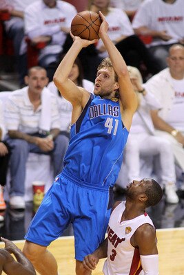 MIAMI, FL - JUNE 12: Dirk Nowitzki #41 of the Dallas Mavericks attempts a shot against the Dwyane Wade #3 of the Miami Heat in Game Six of the 2011 NBA Finals at American Airlines Arena on June 12, 2011 in Miami, Florida. NOTE TO USER: User expressly ack MIAMI, FL - JUNE 12: Dirk Nowitzki #41 of the Dallas Mavericks attempts a shot against the Dwyane Wade #3 of the Miami Heat in Game Six of the 2011 NBA Finals at American Airlines Arena on June 12, 2011 in Miami, Florida. NOTE TO USER: User expressly ack
