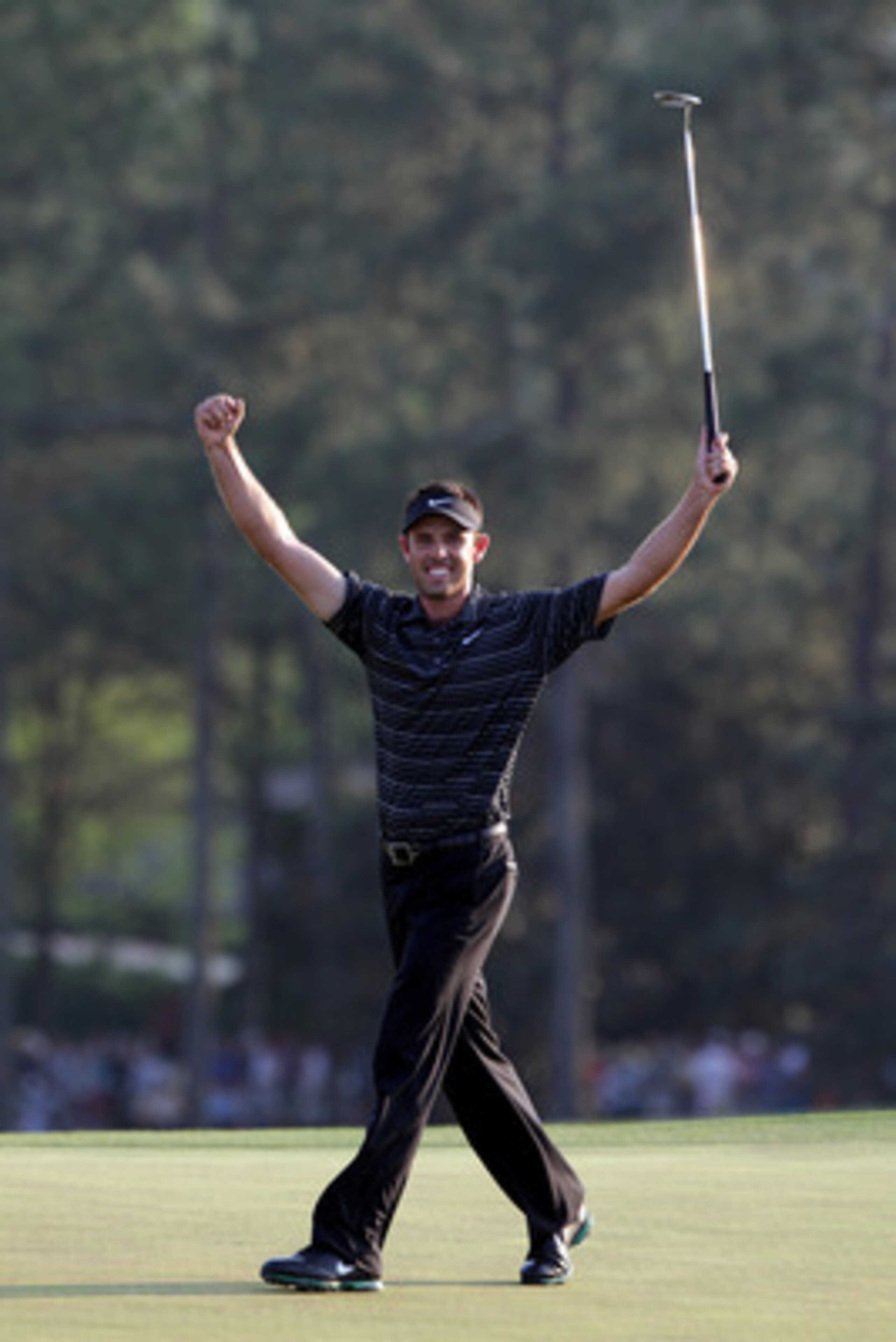 AUGUSTA, GA - APRIL 10:  Charl Schwartzel of South Africa celebrates his birdie on the 18th green and winning the Masters during the final round of the 2011 Masters Tournament at Augusta National Golf Club on April 10, 2011 in Augusta, Georgia.  (Photo by