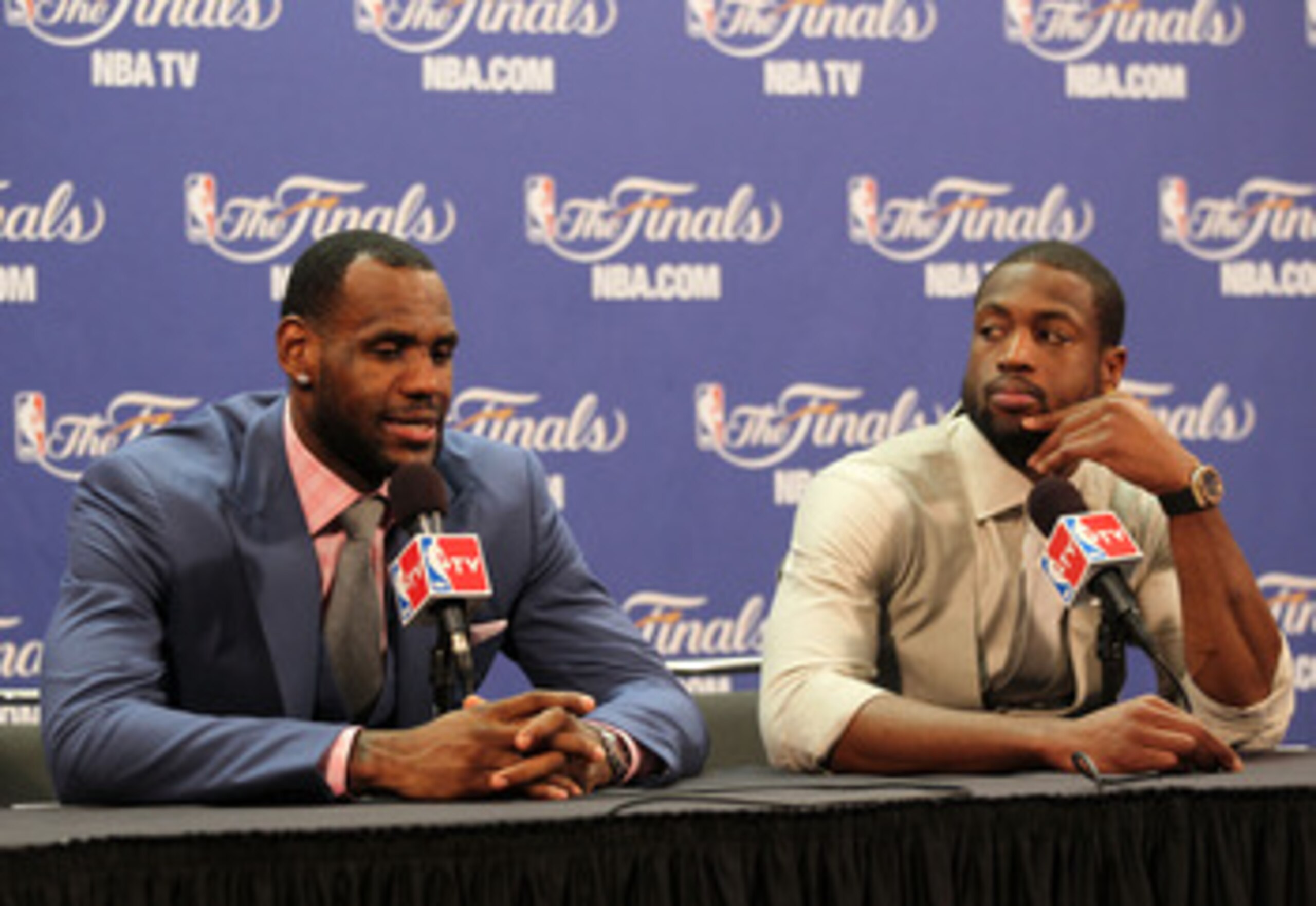 MIAMI, FL - JUNE 12:  LeBron James #6 and Dwyane Wade #3 of the Miami Heat answer questions after the Heat were defeated 105-95 by the Dallas Mavericks in Game Six of the 2011 NBA Finals at American Airlines Arena on June 12, 2011 in Miami, Florida. NOTE 