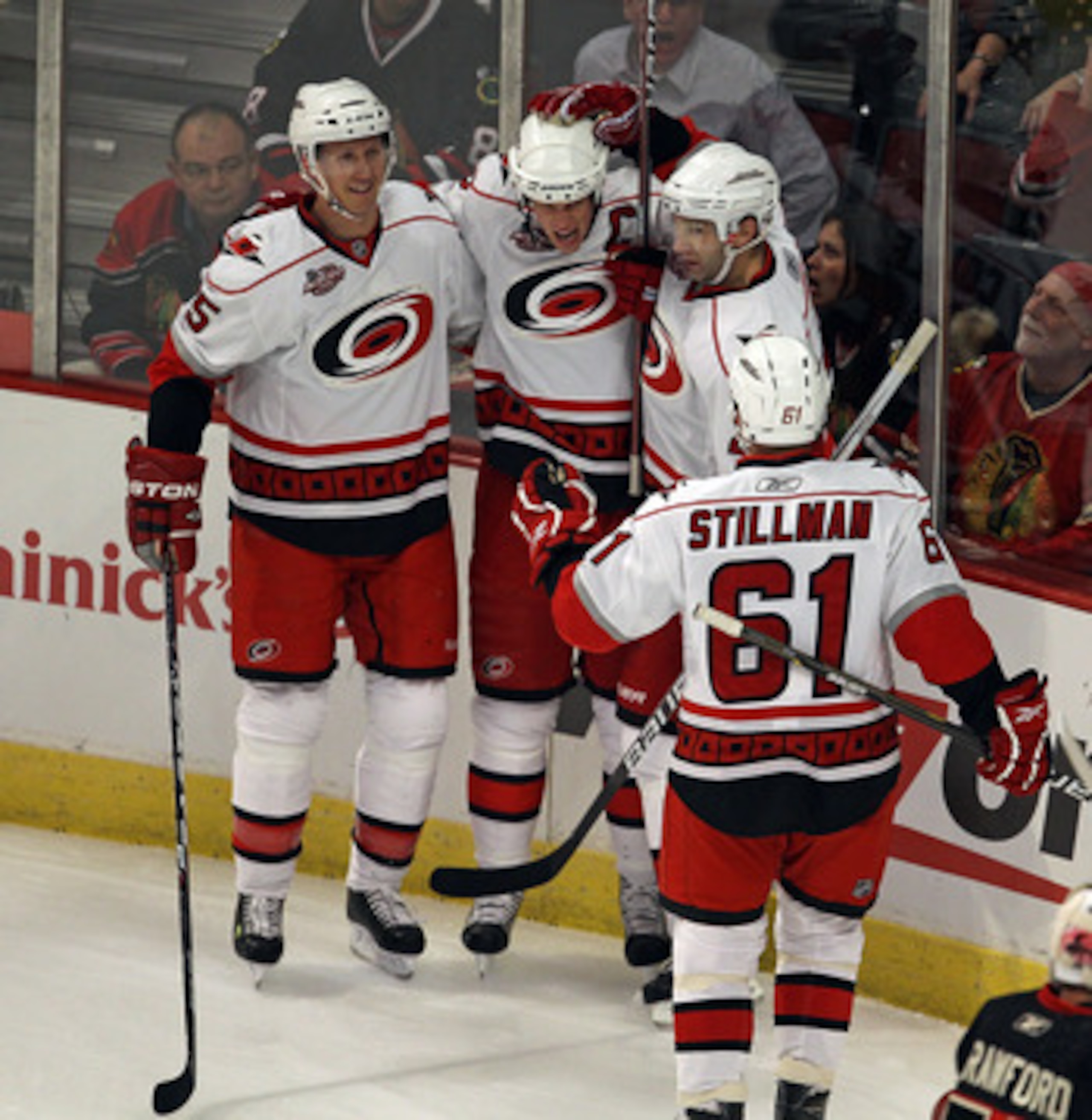 CHICAGO, IL - MARCH 04: (L-R) Bryan Allen #5, Eric Staal #12, Erik Cole #26 and Cory Stillman #61 of the Carolina Hurricanes celebrate a 1st period goal by Staal against the Chicago Blackhawks at the United Center on March 4, 2011 in Chicago, Illinois. (P