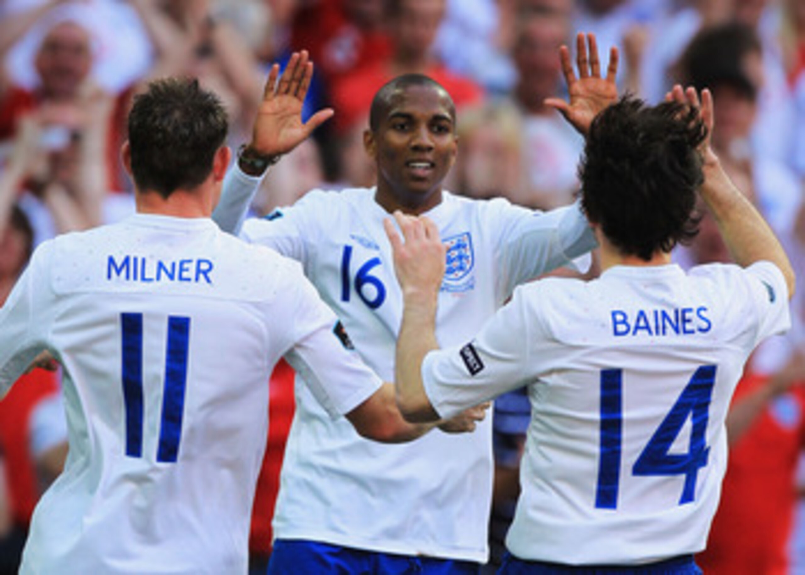 LONDON, ENGLAND - JUNE 04:  Ashley Young of England (C) celebrates scoring their second goal with teammates James Milner (L) and Leighton Baines during the UEFA EURO 2012 group G qualifying match between England and Switzerland at Wembley Stadium on June