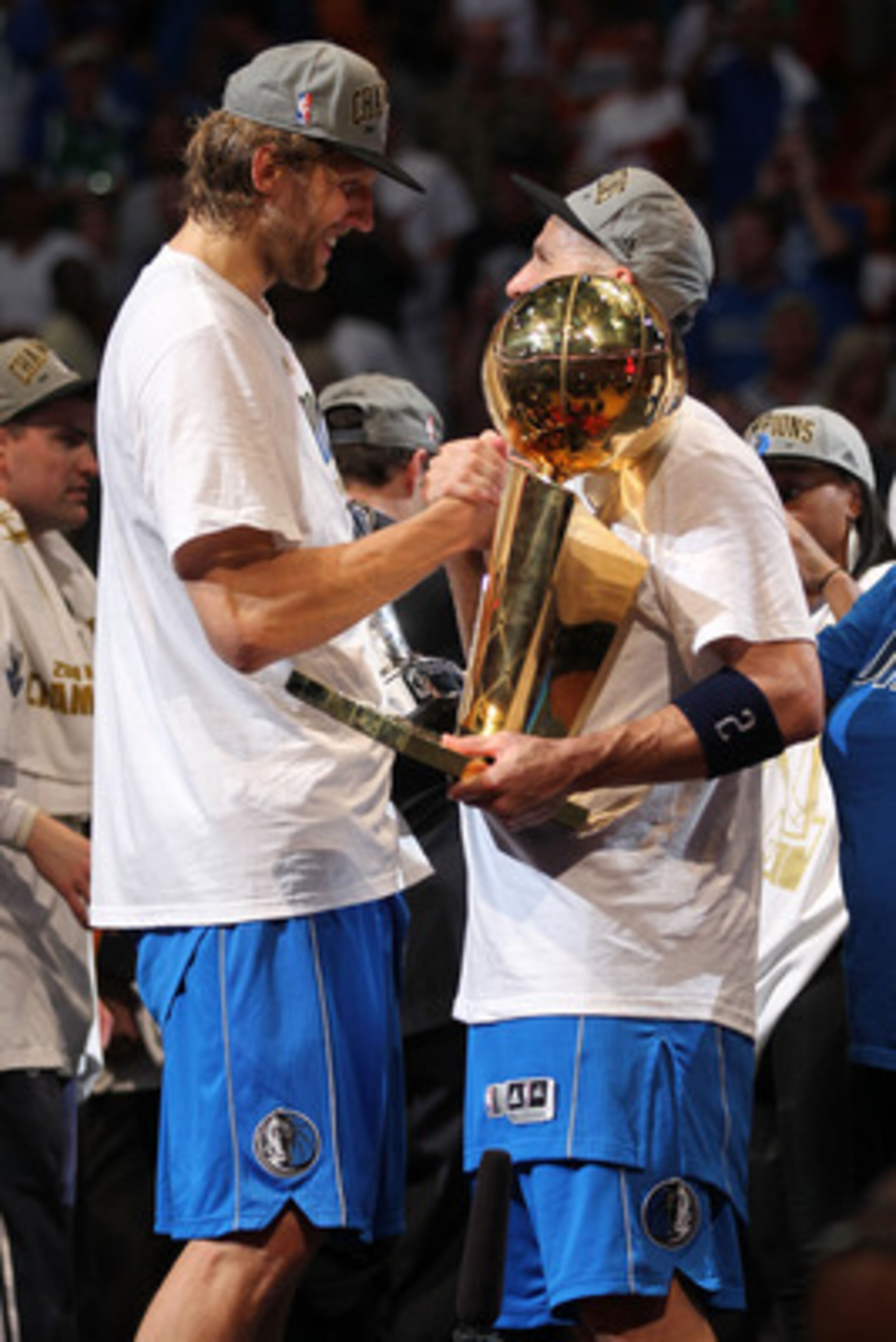 MIAMI, FL - JUNE 12:  (L-R) Dirk Nowitzki #41 and Jason Kidd #2 of the Dallas Mavericks celebrate with the larry O'Brien trophy after the Mavericks won 105-95 against the Miami Heat in Game Six of the 2011 NBA Finals at American Airlines Arena on June 12,